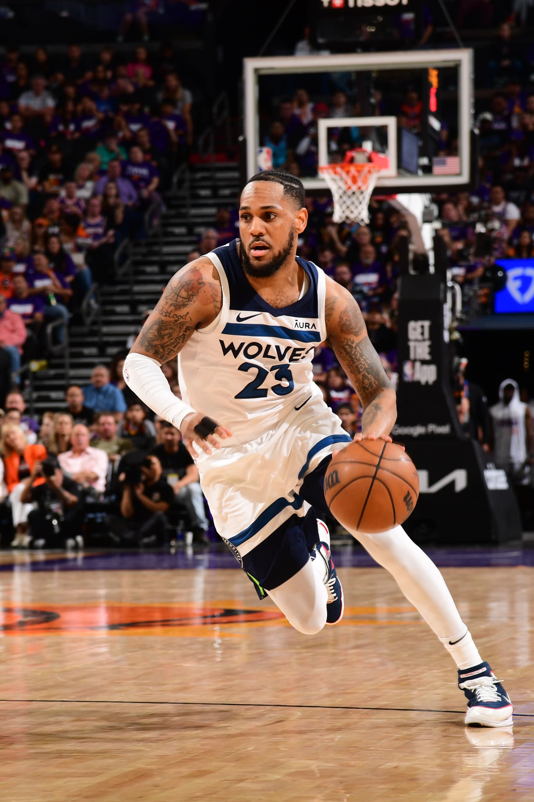 PHOENIX, AZ - APRIL  26: Monte Morris #23 of the Minnesota Timberwolves handles the ball during the game against the Phoenix Suns on April 26, 2024 at Footprint Center in Phoenix, Arizona. NOTE TO USER: User expressly acknowledges and agrees that, by downloading and or using this photograph, user is consenting to the terms and conditions of the Getty Images License Agreement. Mandatory Copyright Notice: Copyright 2024 NBAE (Photo by Kate Frese/NBAE via Getty Images)