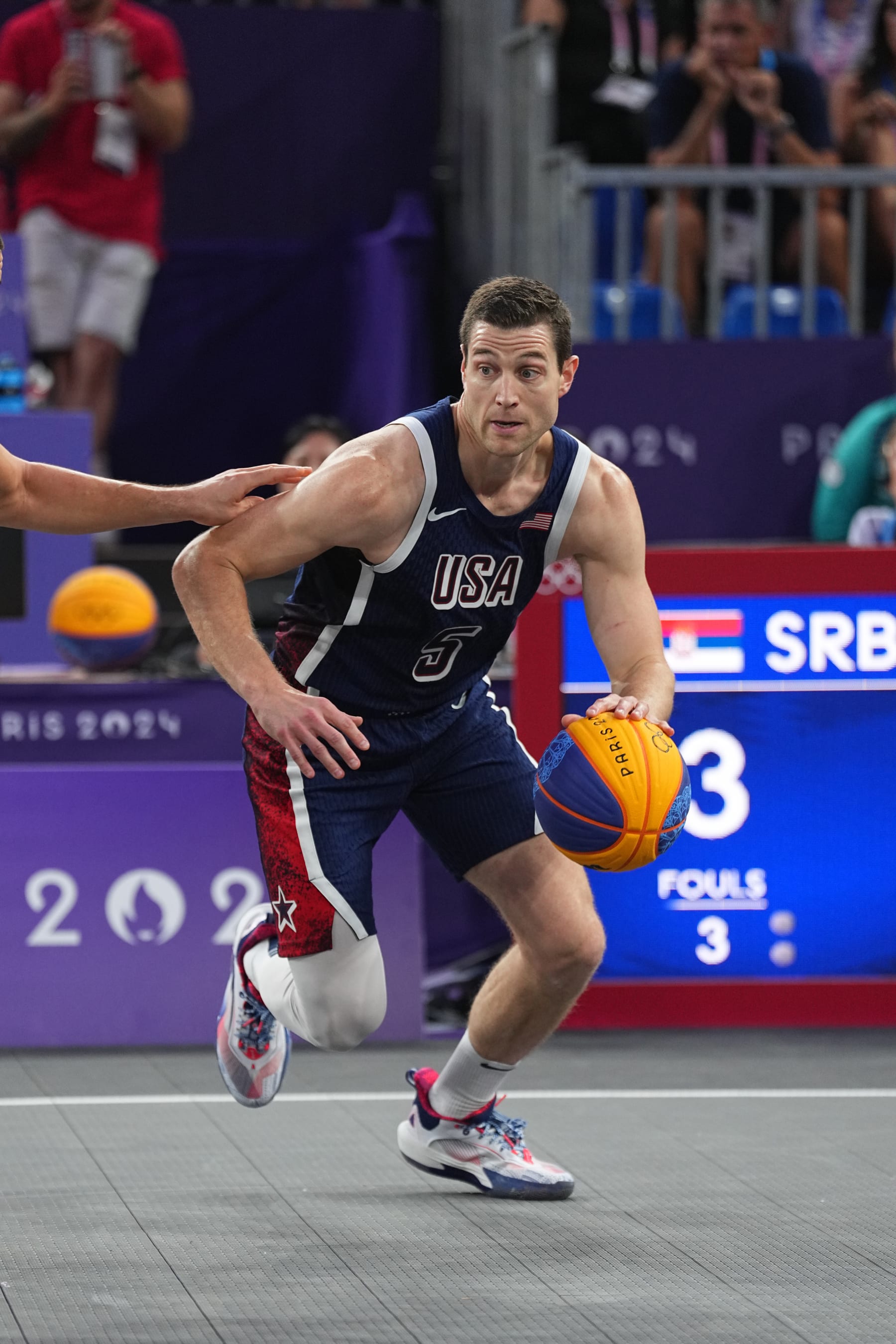 PARIS, FRANCE - JULY 30: Jimmer Fredette #5 of Team USA 3x3 handles the ball during the game at the Place de la Concorde on July 30, 2024 in Paris, France. NOTE TO USER: User expressly acknowledges and agrees that, by downloading and/or using this photograph, user is consenting to the terms and conditions of the Getty Images License Agreement. Mandatory Copyright Notice: Copyright 2024 NBAE (Photo by Garrett W. Ellwood/NBAE via Getty Images)