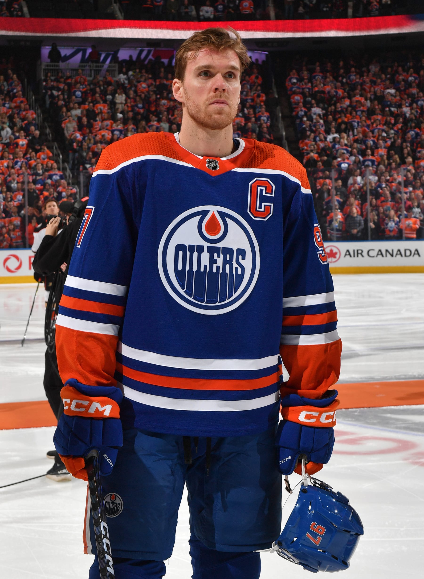EDMONTON, CANADA - APRIL 01: Connor McDavid #97 of the Edmonton Oilers stands for the playing of the national anthem before the game against the Anaheim Ducks on April 1, 2023 at Rogers Place in Edmonton, Alberta, Canada. (Photo by Andy Devlin/NHLI via Getty Images)