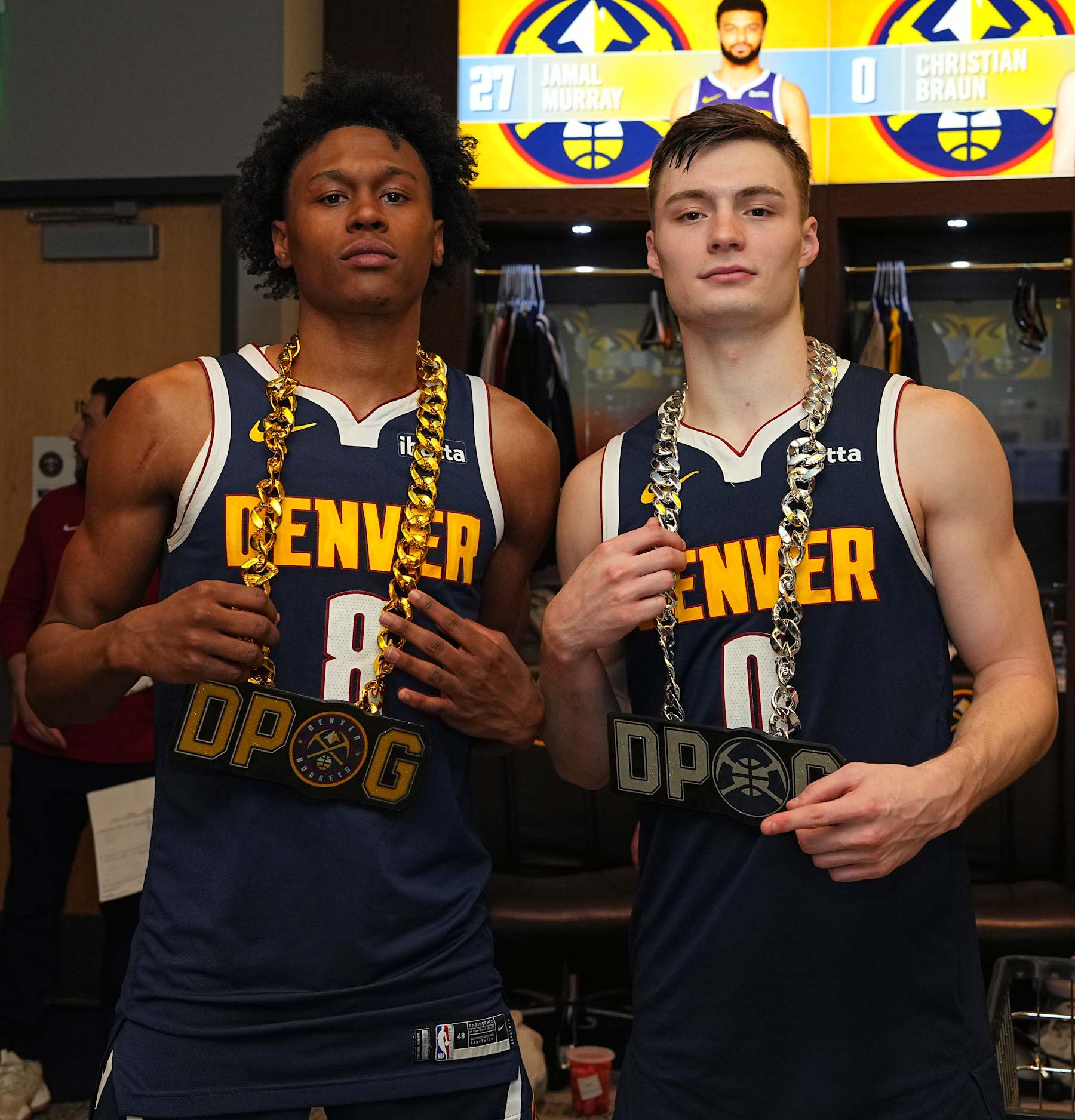 DENVER, CO - APRIL 10: Peyton Watson #8 and Christian Braun #0 of the Denver Nuggets wear the team's defensive player of the game chains after the game against the Minnesota Timberwolves on April 10, 2024 at the Ball Arena in Denver, Colorado. NOTE TO USER: User expressly acknowledges and agrees that, by downloading and/or using this Photograph, user is consenting to the terms and conditions of the Getty Images License Agreement. Mandatory Copyright Notice: Copyright 2024 NBAE (Photo by Garrett Ellwood/NBAE via Getty Images)