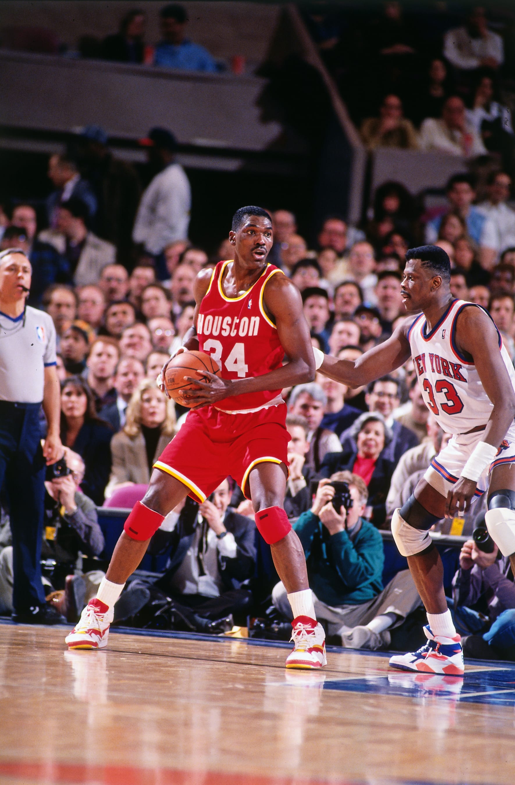 NEW YORK CITY - 1993: Hakeem Olajuwon #34 of the Houston Rockets handles the ball during the game against the New York Knicks circa 1993 at Madison Square Garden in New York City. NOTE TO USER: User expressly acknowledges and agrees that, by downloading and or using this photograph, User is consenting to the terms and conditions of the Getty Images License Agreement. Mandatory Copyright Notice: Copyright 1993 NBAE (Photo by Nathaniel S. Butler/NBAE via Getty Images)