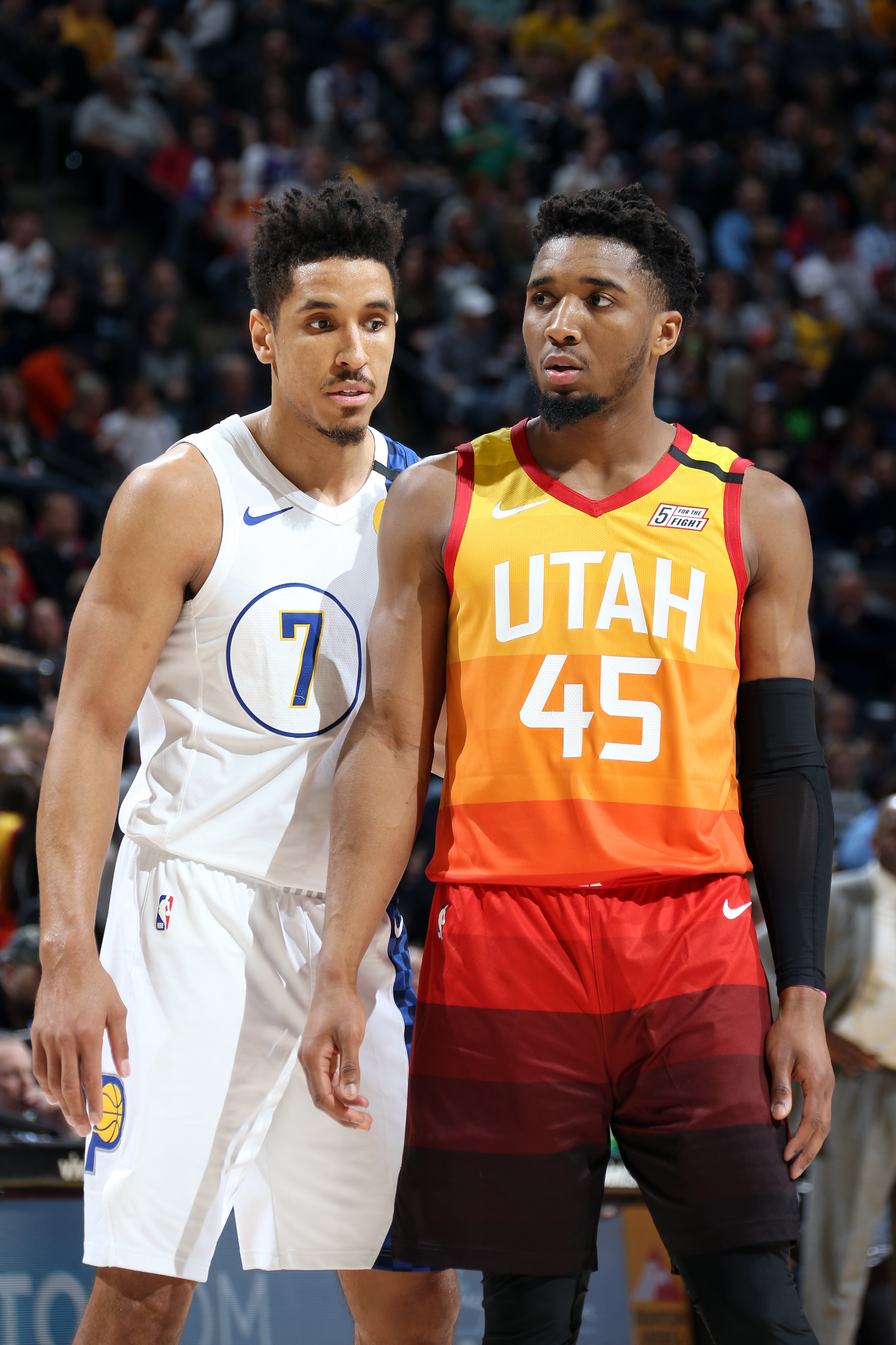 SALT LAKE CITY, UT - JANUARY 20: Malcolm Brogdon #7 of the Indiana Pacers and Donovan Mitchell #45 of the Utah Jazz look on during the game on January 20, 2020 at vivint.SmartHome Arena in Salt Lake City, Utah. NOTE TO USER: User expressly acknowledges and agrees that, by downloading and or using this Photograph, User is consenting to the terms and conditions of the Getty Images License Agreement. Mandatory Copyright Notice: Copyright 2020 NBAE (Photo by Melissa Majchrzak/NBAE via Getty Images)