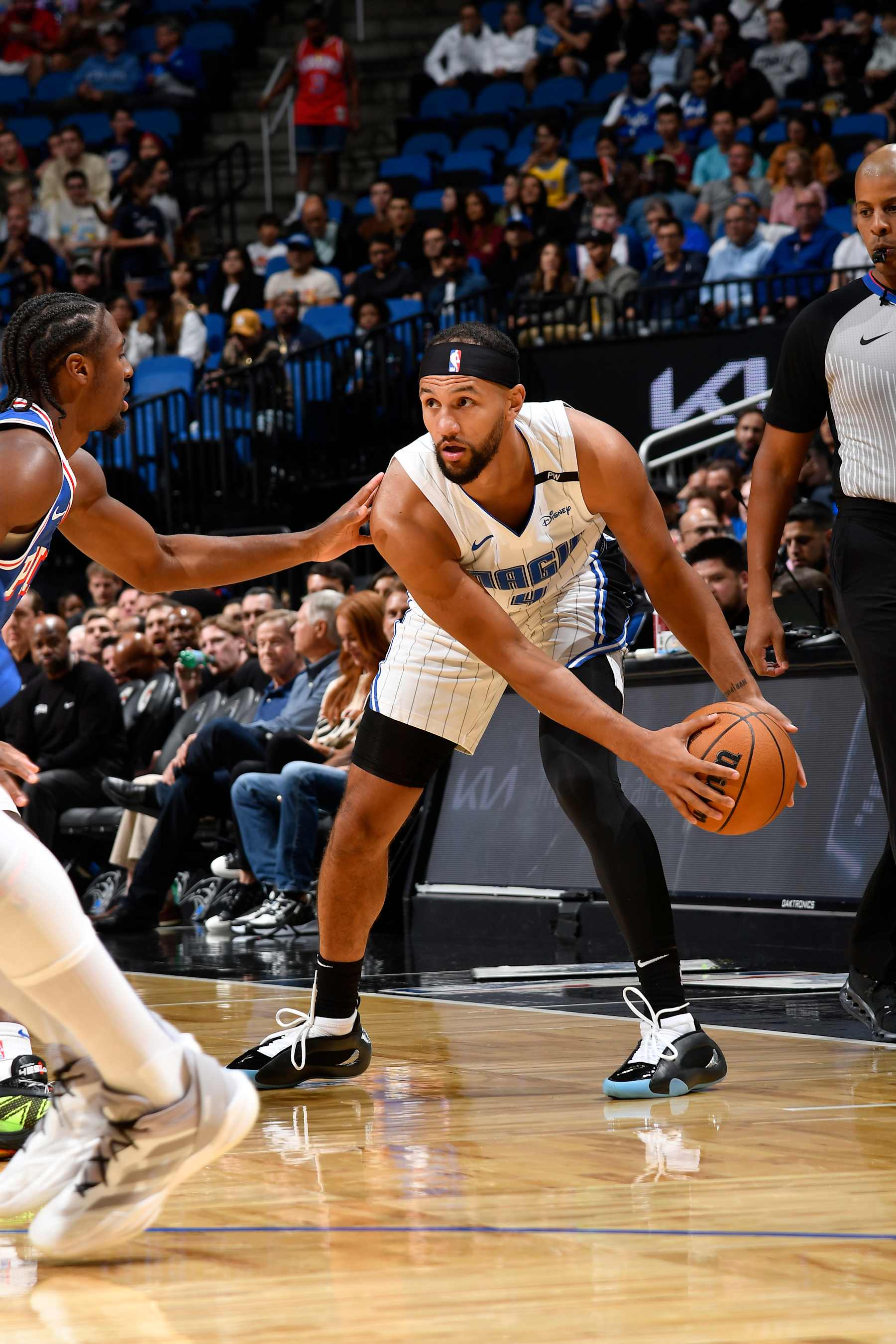 ORLANDO, FL - OCTOBER 18: Jalen Suggs #4 of the Orlando Magic handles the ball during the game against the Philadelphia 76ersduring a NBA preseason game on October 18, 2024 at Kia Center in Orlando, Florida. NOTE TO USER: User expressly acknowledges and agrees that, by downloading and or using this photograph, User is consenting to the terms and conditions of the Getty Images License Agreement. Mandatory Copyright Notice: Copyright 2024 NBAE (Photo by Fernando Medina/NBAE via Getty Images)