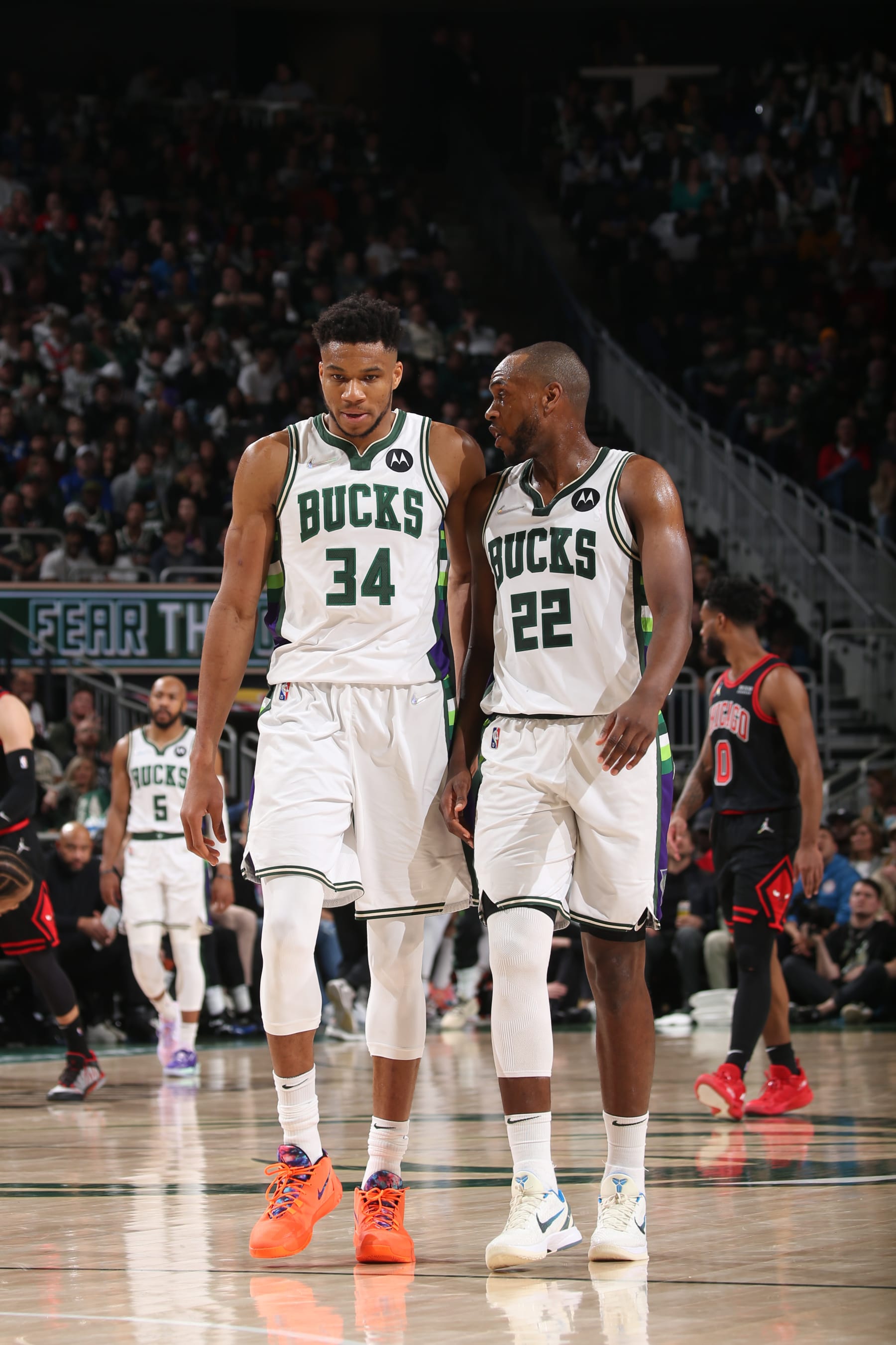MILWAUKEE, WI - APRIL 17: Giannis Antetokounmpo #34 and Khris Middleton #22 of the Milwaukee Bucks embrace during Round 1 Game 1 of the 2022 NBA Playoffs on April 17, 2022 at the Fiserv Forum Center in Milwaukee, Wisconsin. NOTE TO USER: User expressly acknowledges and agrees that, by downloading and or using this Photograph, user is consenting to the terms and conditions of the Getty Images License Agreement. Mandatory Copyright Notice: Copyright 2022 NBAE (Photo by Gary Dineen/NBAE via Getty Images).
