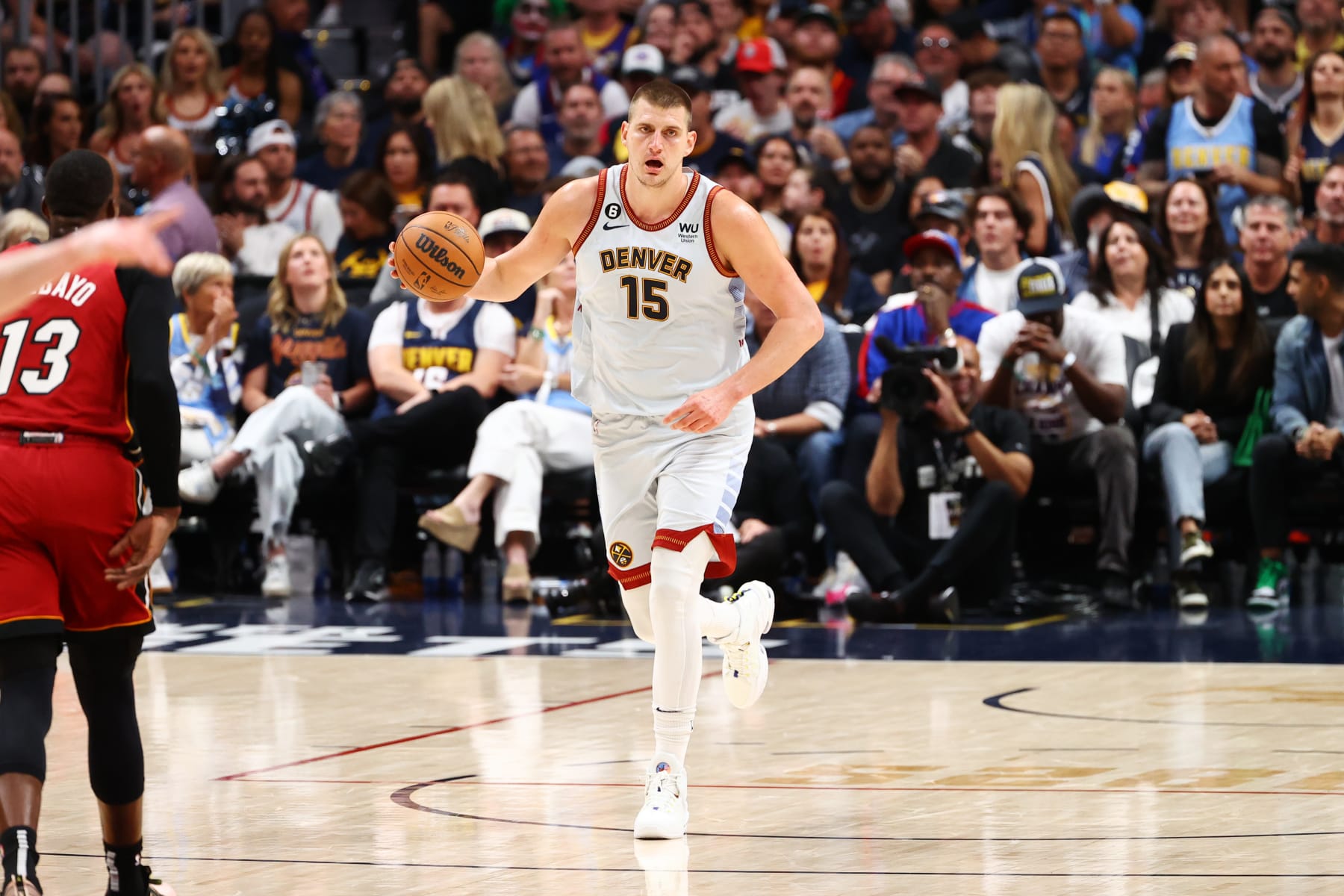 DENVER, CO - JUNE 12: Nikola Jokic #15 of the Denver Nuggets dribbles the ball during game 5 of the 2023 NBA Finals against the Miami Heat on June 12, 2023 at the Ball Arena in Denver, Colorado. NOTE TO USER: User expressly acknowledges and agrees that, by downloading and/or using this Photograph, user is consenting to the terms and conditions of the Getty Images License Agreement. Mandatory Copyright Notice: Copyright 2023 NBAE (Photo by Jamie Schwaberow/NBAE via Getty Images)
