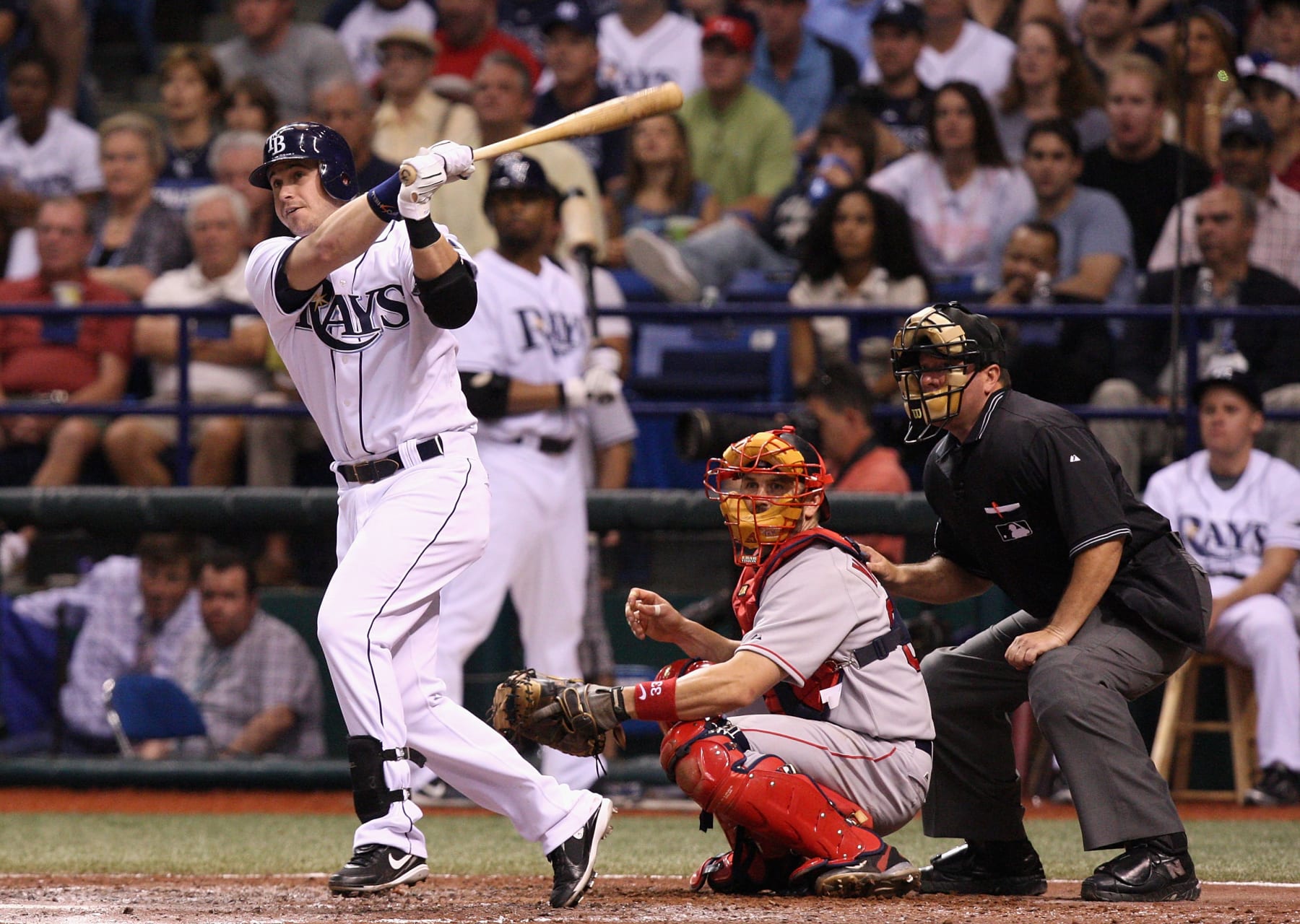 ST. PETERSBURG, FL - OCTOBER 11:  Evan Longoria #3 of the Tampa Bay Rays hits a RBI double against the Boston Red Sox in the fifth inning of game two of the American League Championship Series during the 2008 MLB playoffs at Tropicana Field on October 11, 2008 in St. Petersburg, Florida.  (Photo by Doug Benc/Getty Images)