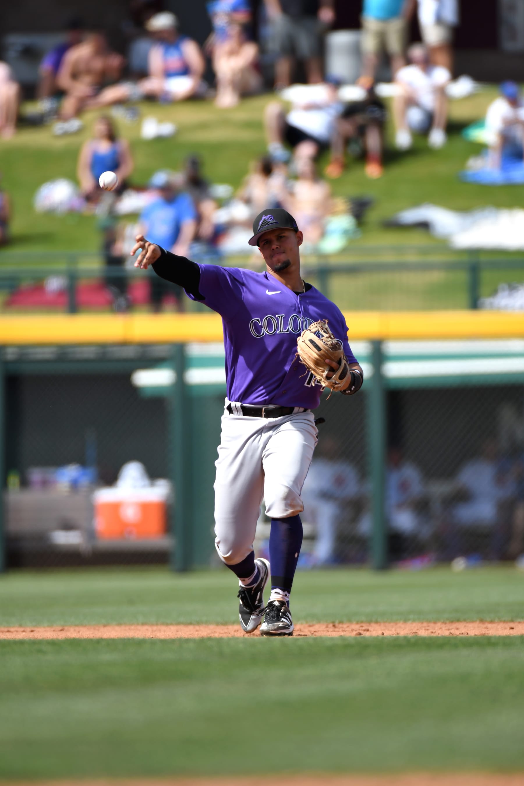 MESA, AZ - MARCH 25, 2022: Ezequiel Tovar #14 of the Colorado Rockies throws to first base during the fourth inning of an MLB spring training game against the Chicago Cubs at Sloan Park on March 25, 2022 in Mesa, Arizona. (Photo by David Durochik/Diamond Images via Getty Images)