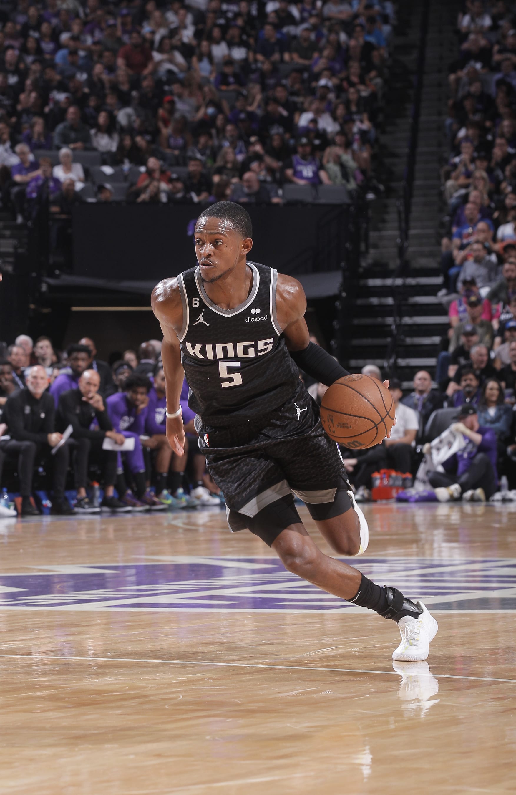 SACRAMENTO, CA - OCTOBER 19: DeAaron Fox #5 of the Sacramento Kings dribbles the ball during the game game against the Portland Trail Blazers on October 19, 2022 at Golden 1 Center in Sacramento, California. NOTE TO USER: User expressly acknowledges and agrees that, by downloading and or using this photograph, User is consenting to the terms and conditions of the Getty Images Agreement. Mandatory Copyright Notice: Copyright 2022 NBAE (Photo by Rocky Widner/NBAE via Getty Images)