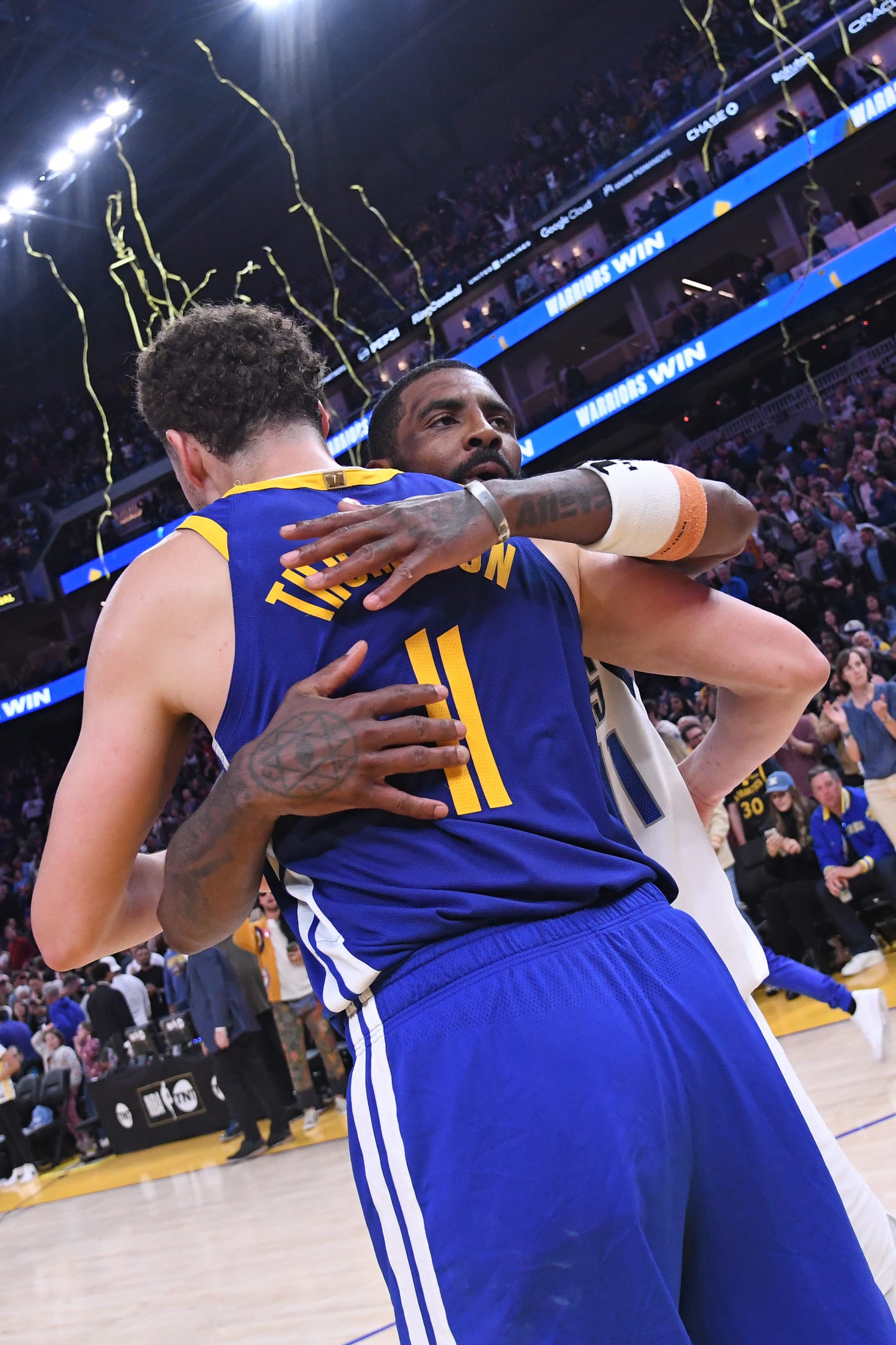 SAN FRANCISCO, CA - APRIL 2: Klay Thompson #11 of the Golden State Warriors and Kyrie Irving #11 of the Dallas Mavericks embrace after the game on April 2, 2024 at Chase Center in San Francisco, California. NOTE TO USER: User expressly acknowledges and agrees that, by downloading and or using this photograph, user is consenting to the terms and conditions of Getty Images License Agreement. Mandatory Copyright Notice: Copyright 2024 NBAE (Photo by Noah Graham/NBAE via Getty Images)