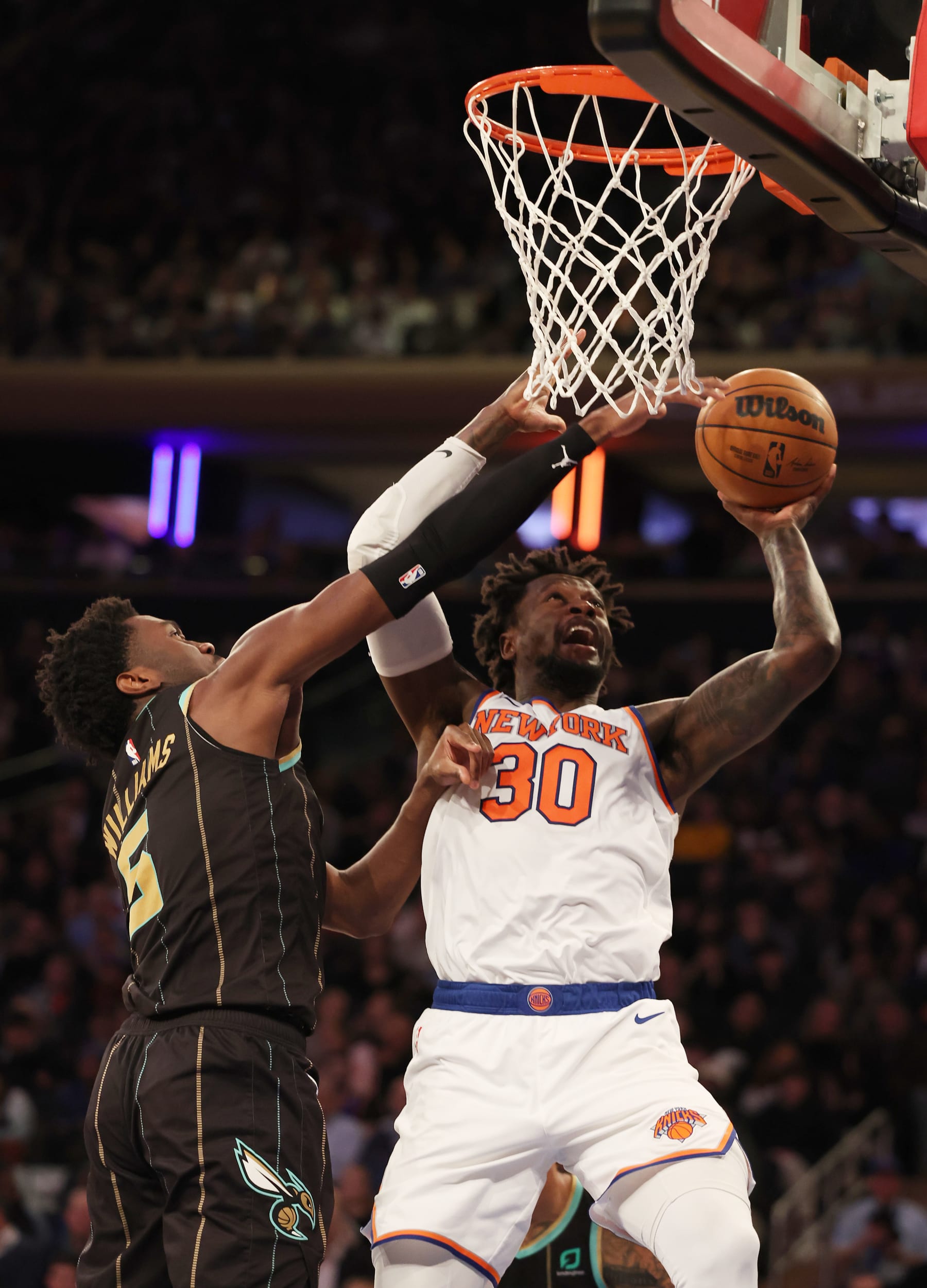 NEW YORK, NEW YORK - MARCH 07:  Julius Randle #30 of the New York Knicks shoots against Mark Williams #5 of the Charlotte Hornets during their game at Madison Square Garden on March 07, 2023 in New York City.  User expressly acknowledges and agrees that, by downloading and or using this photograph, User is consenting to the terms and conditions of the Getty Images License Agreement.   (Photo by Al Bello/Getty Images)