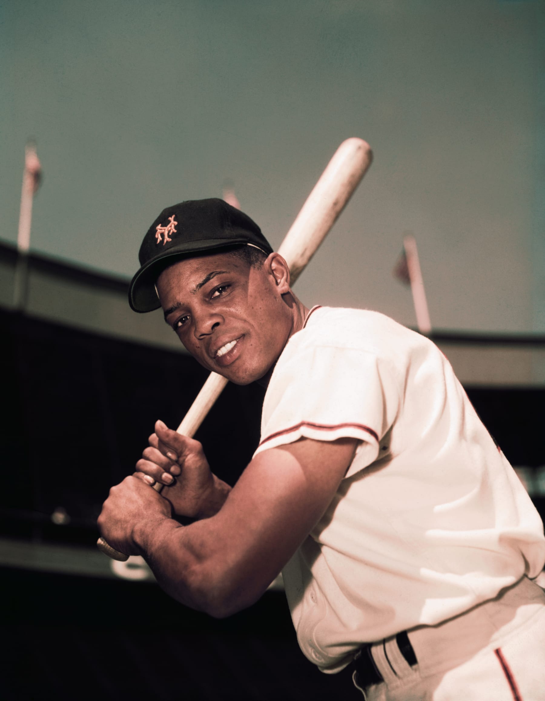 (Original Caption) American baseball player Willie Mays of the New York Giants holds his bat, here in this three-quarters length photo, 1954-08-18.