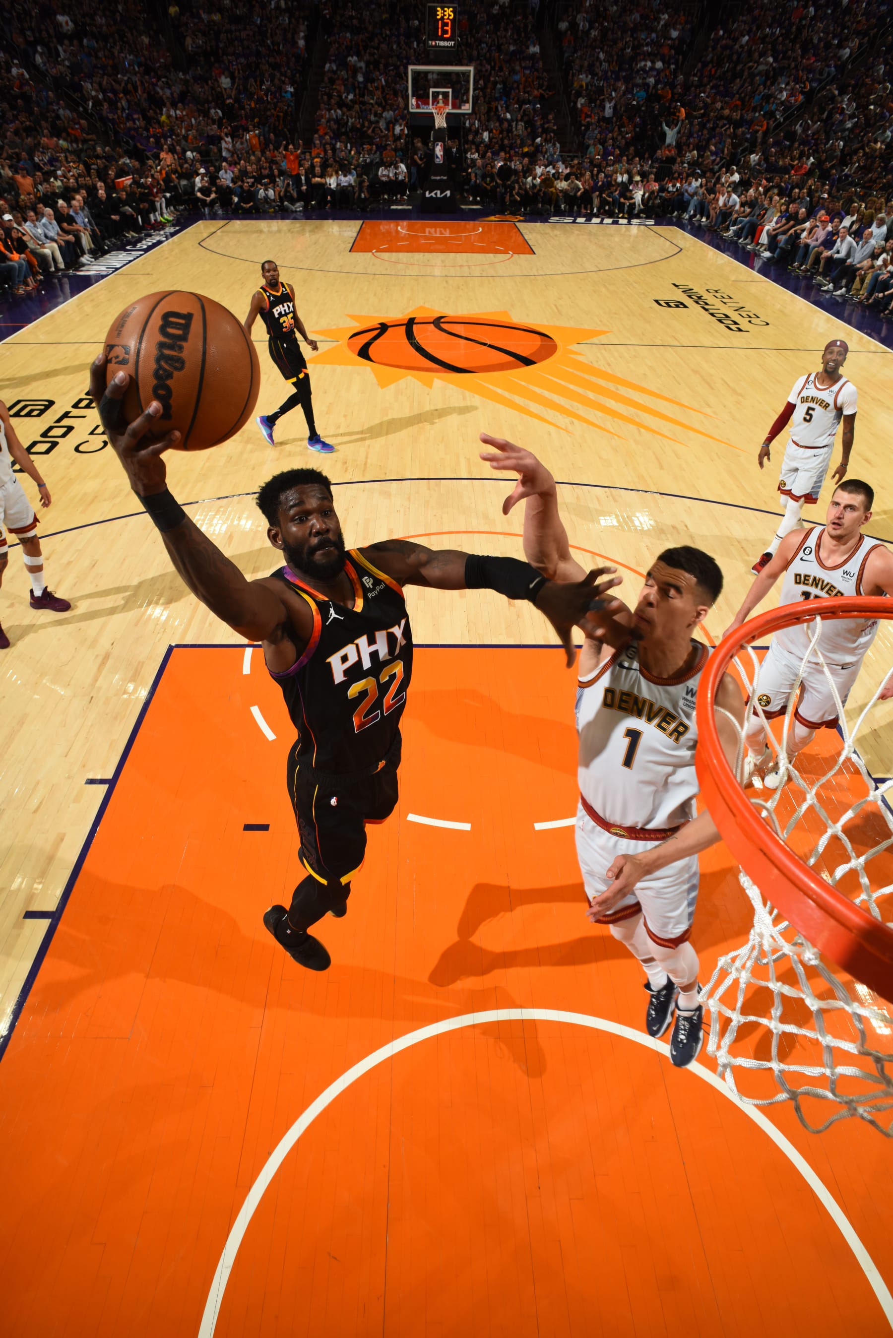 PHOENIX, AZ - MAY 5: Deandre Ayton #22 of the Phoenix Suns drives to the basket during Game Three of the Western Conference Semi-Finals of the 2023 NBA Playoffs against the Denver Nuggets on May 5, 2023 at Footprint Center in Phoenix, Arizona. NOTE TO USER: User expressly acknowledges and agrees that, by downloading and or using this photograph, user is consenting to the terms and conditions of the Getty Images License Agreement. Mandatory Copyright Notice: Copyright 2023 NBAE (Photo by Garrett Ellwood/NBAE via Getty Images)
