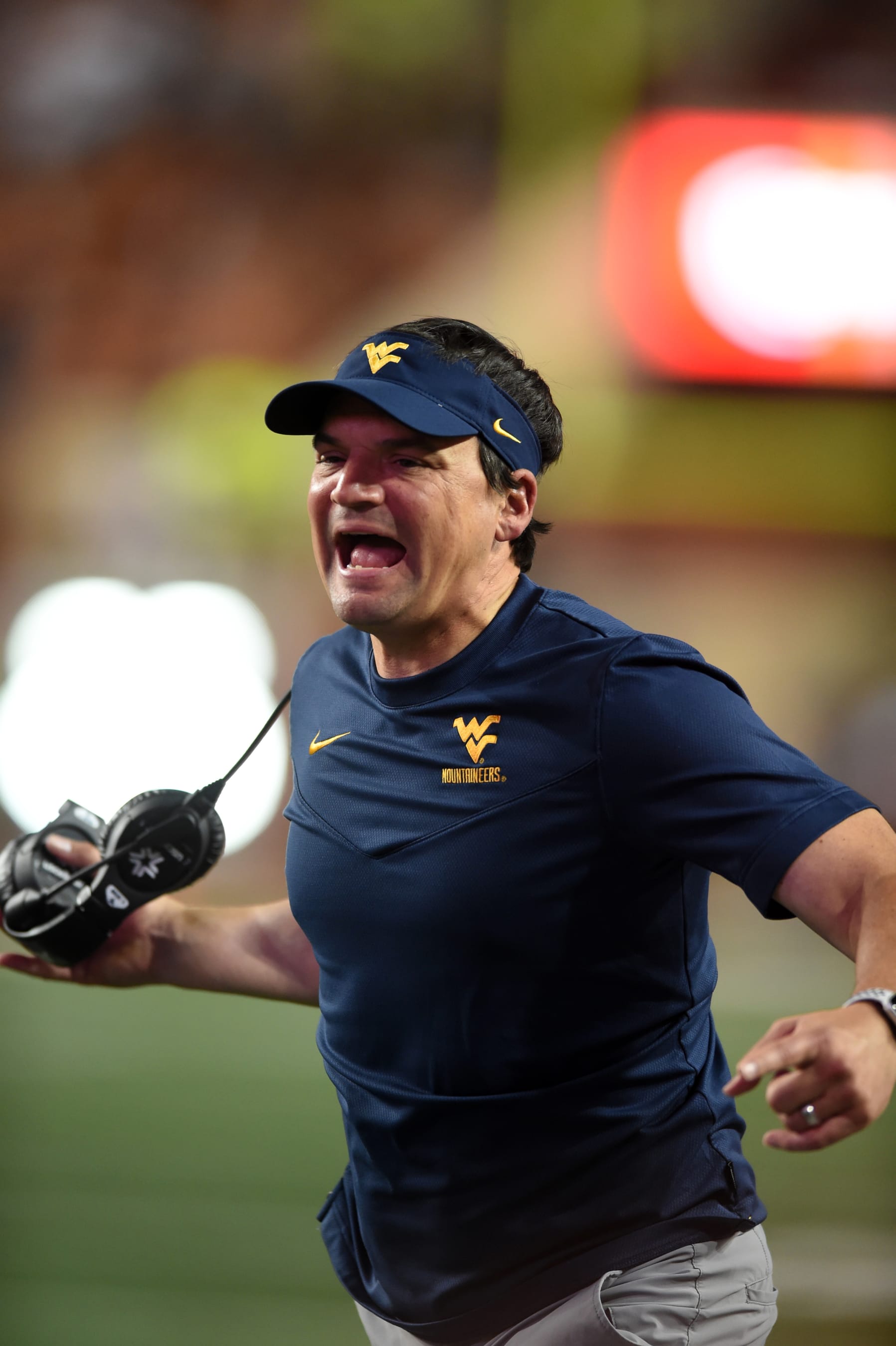 AUSTIN, TX - OCTOBER 01: West Virginia Mountaineers head coach Neal Brown yells at referees during game between the West Virginia Mountaineers and the Texas Longhorns on October 1, 2022, at Darrell K Royal-Texas Memorial Stadium in Austin, Texas.  (Photo by John Rivera/Icon Sportswire via Getty Images)