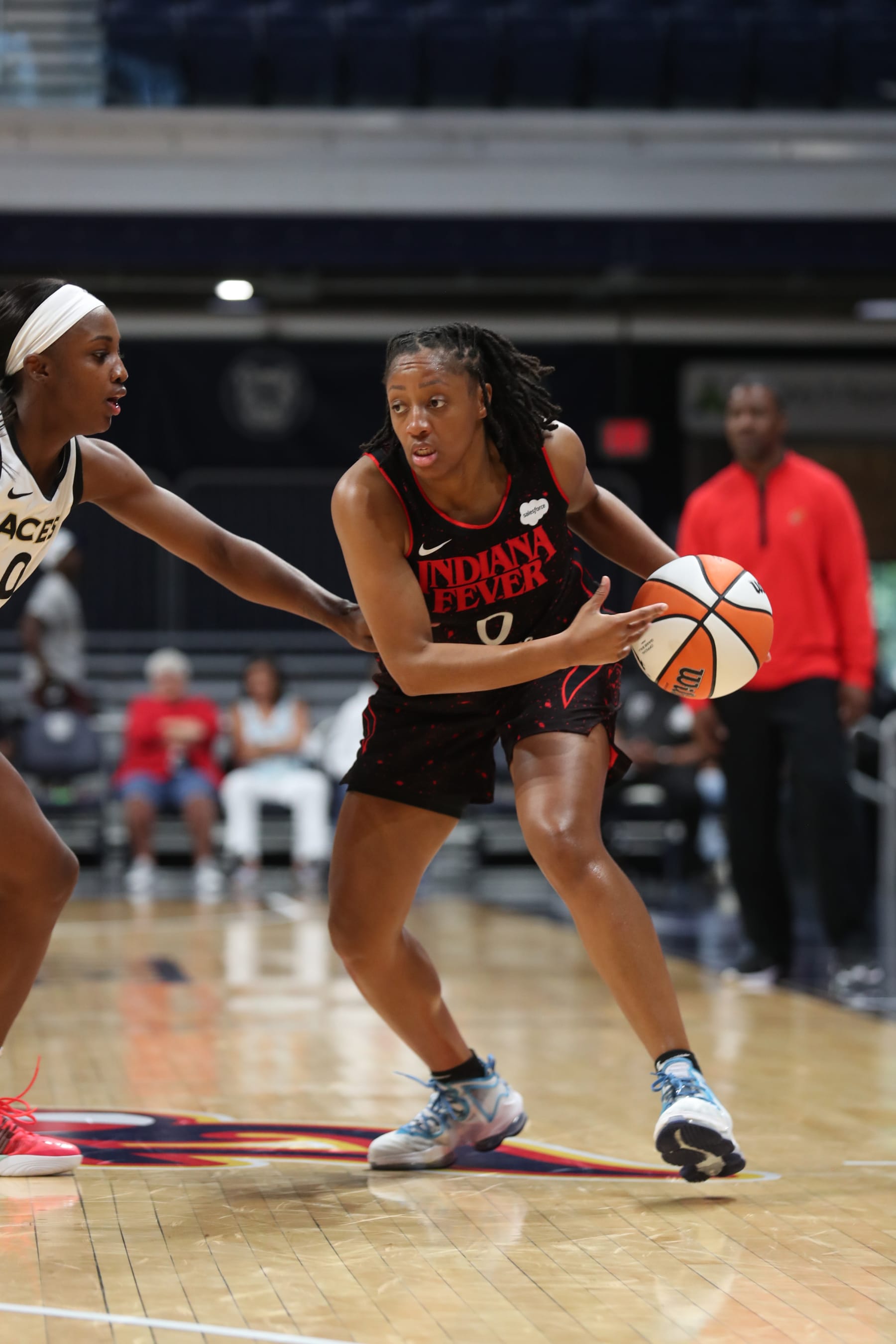 INDIANAPOLIS, IN  - JULY 29: Kelsey Mitchell #0 of the Indiana Fever handles the ball during the game during the game against the Las Vegas Aces on July 29, 2022 at Gainbridge Fieldhouse in Indianapolis, Indiana. NOTE TO USER: User expressly acknowledges and agrees that, by downloading and or using this Photograph, user is consenting to the terms and conditions of the Getty Images License Agreement. Mandatory Copyright Notice: Copyright 2022 NBAE (Photo by Pepper Robinson/NBAE via Getty Images)