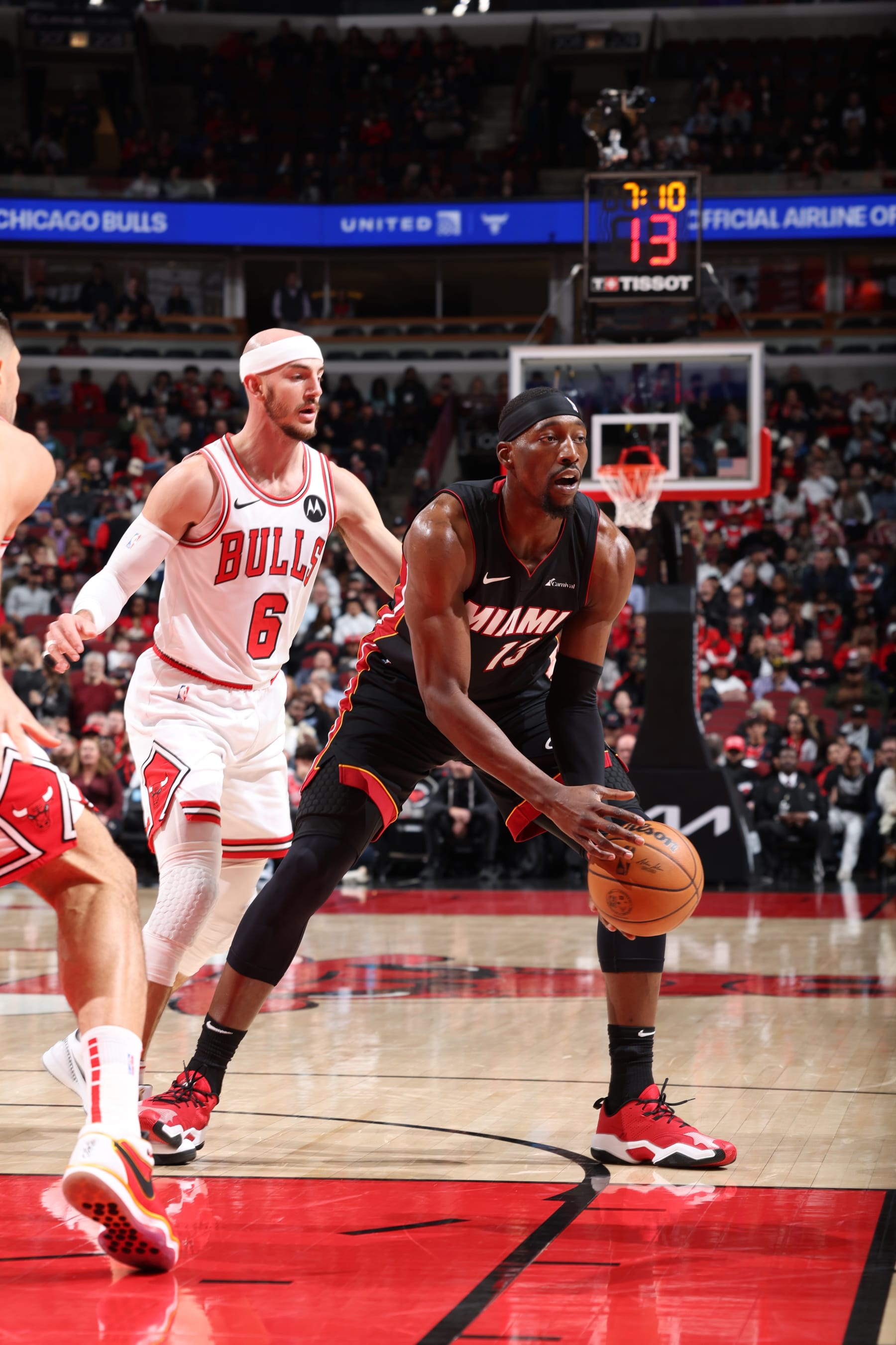 CHICAGO, IL - NOVEMBER 20: Bam Adebayo #13 of the Miami Heat looks to pass the ball during the game against the Chicago Bulls on November 20, 2023 at United Center in Chicago, Illinois. NOTE TO USER: User expressly acknowledges and agrees that, by downloading and or using this photograph, User is consenting to the terms and conditions of the Getty Images License Agreement. Mandatory Copyright Notice: Copyright 2023 NBAE (Photo by Jeff Haynes/NBAE via Getty Images)