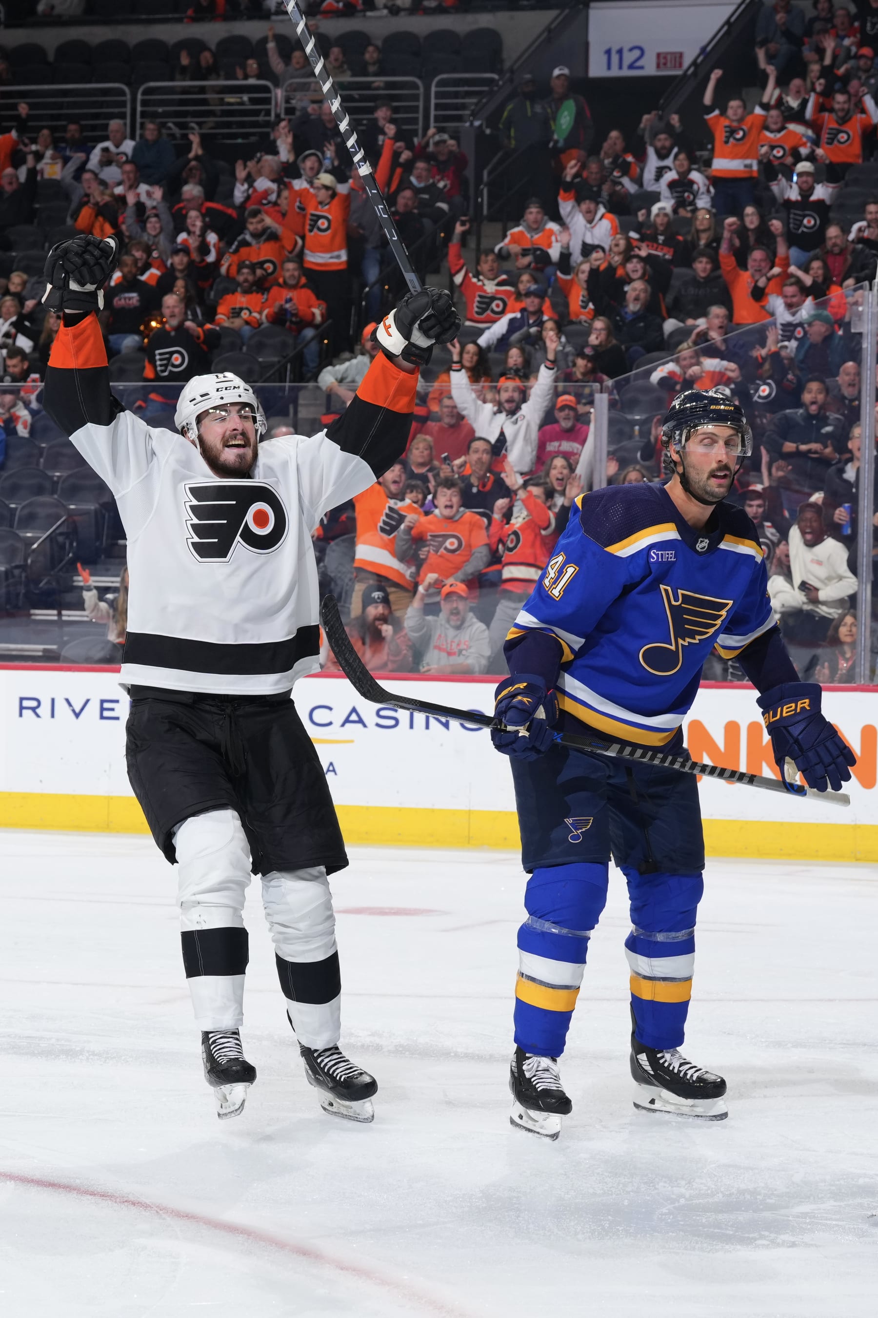 PHILADELPHIA, PA - NOVEMBER 08: Zack MacEwen #17 of the Philadelphia Flyers reacts in front of Robert Bortuzzo #41 of the St. Louis Blues after a goal by Lukas Sedlak #23 (not pictured) in the third period at the Wells Fargo Center on November 8, 2022 in Philadelphia, Pennsylvania. (Photo by Mitchell Leff/NHLI via Getty Images)