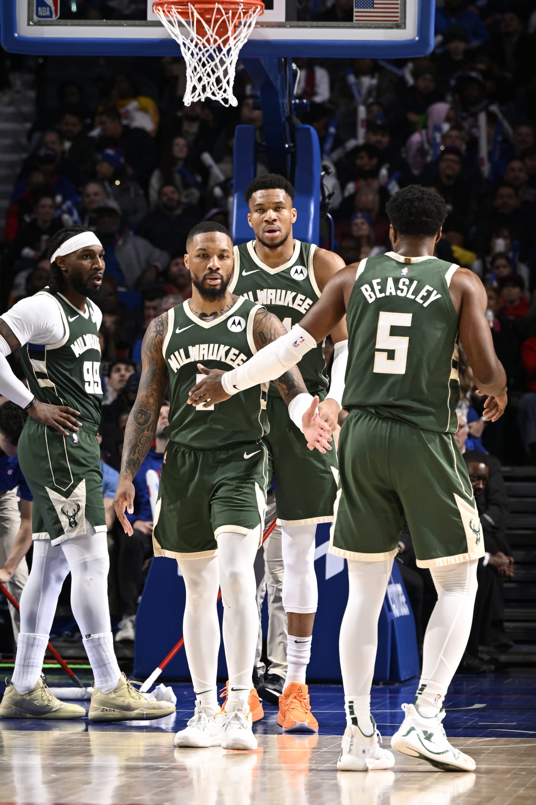 PHILADELPHIA, PA - FEBRUARY 25: Damian Lillard #0 high fives Malik Beasley #5 of the Milwaukee Bucks during the game against the Philadelphia 76ers on February 25, 2024 at the Wells Fargo Center in Philadelphia, Pennsylvania NOTE TO USER: User expressly acknowledges and agrees that, by downloading and/or using this Photograph, user is consenting to the terms and conditions of the Getty Images License Agreement. Mandatory Copyright Notice: Copyright 2024 NBAE (Photo by David Dow/NBAE via Getty Images)