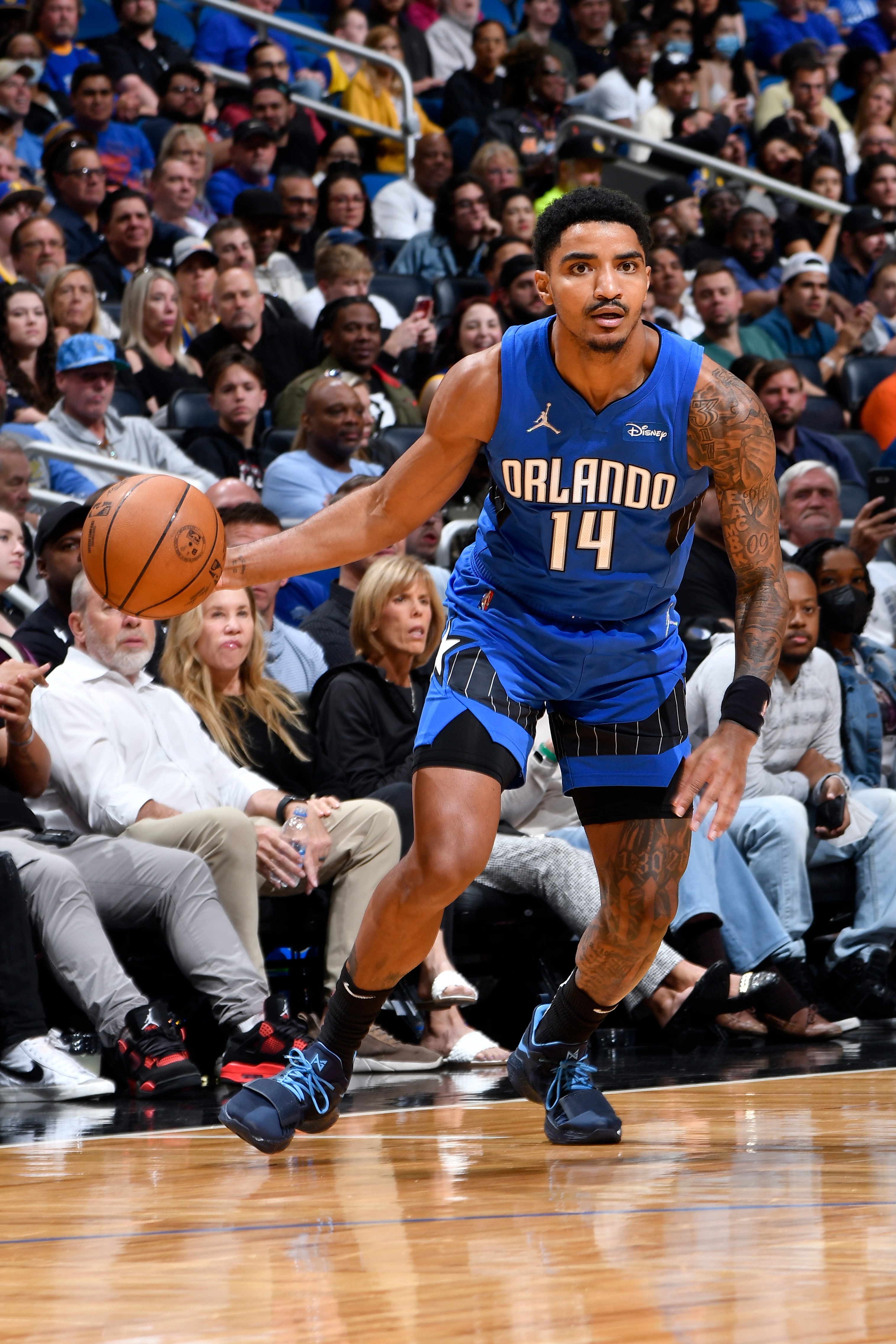 ORLANDO, FL - MARCH 22: Gary Harris #14 of the Orlando Magic drives to the basket during the game against the Golden State Warriors on March 22, 2022 at Amway Center in Orlando, Florida. NOTE TO USER: User expressly acknowledges and agrees that, by downloading and or using this photograph, User is consenting to the terms and conditions of the Getty Images License Agreement. Mandatory Copyright Notice: Copyright 2022 NBAE (Photo by Fernando Medina/NBAE via Getty Images)