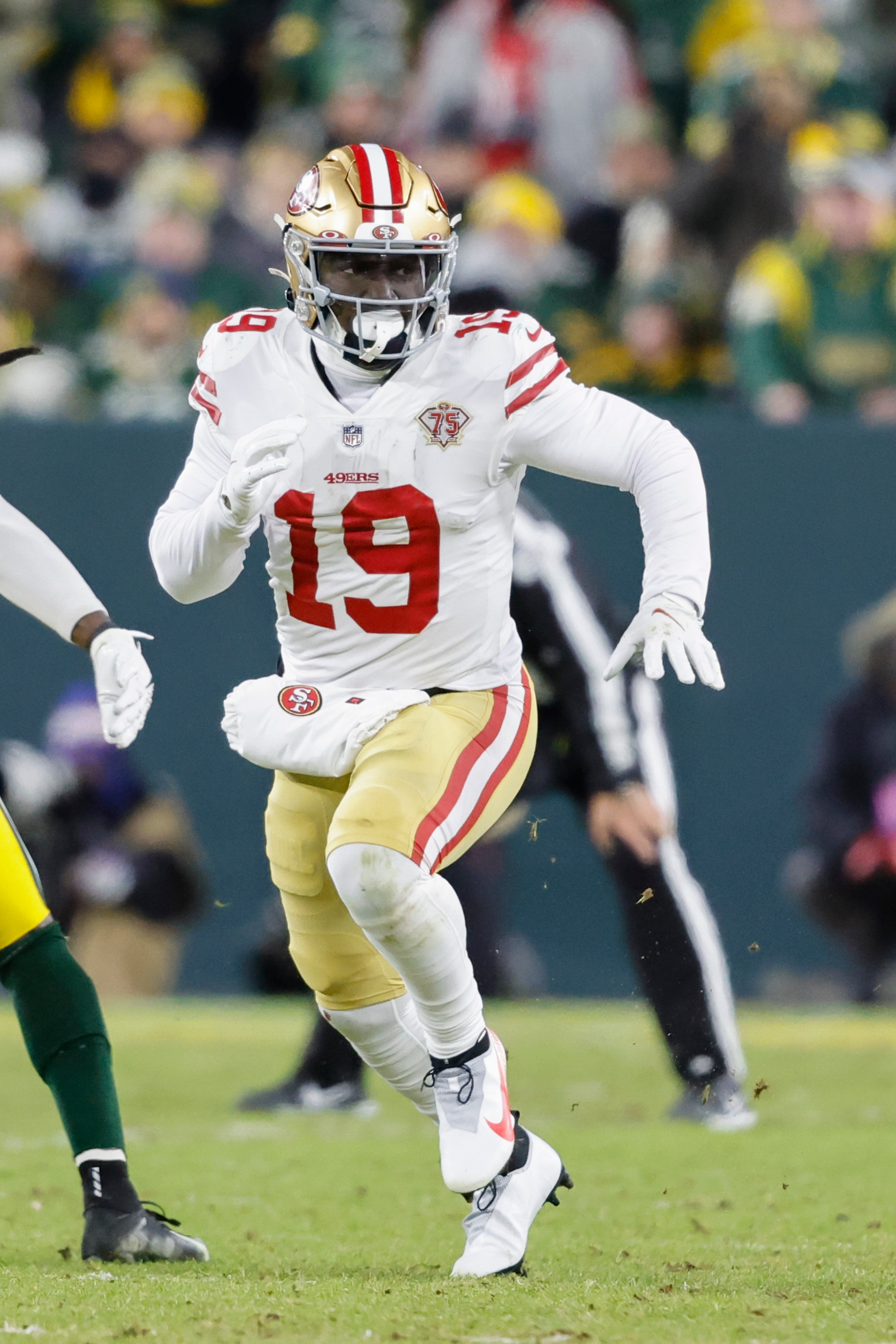 San Francisco 49ers wide receiver Deebo Samuel (19) runs a route during an NFL divisional playoff football game against the Green Bay Packers, Saturday, Jan 22. 2022, in Green Bay, Wis. (AP Photo/Jeffrey Phelps) San Francisco 49ers wide receiver Deebo Samuel (19) runs a route during an NFL divisional playoff football game against the Green Bay Packers, Saturday, Jan 22. 2022, in Green Bay, Wis. (AP Photo/Jeffrey Phelps)