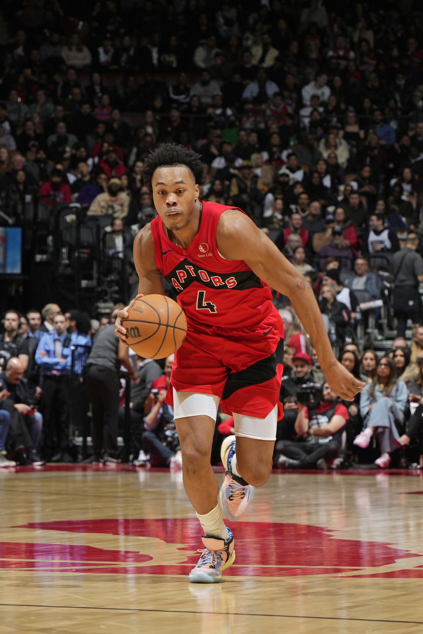 TORONTO, CANADA - FEBRUARY 14: Scottie Barnes #4 of the Toronto Raptors handles the ball during the game against the Indiana Pacers on February 14, 2024 at the Scotiabank Arena in Toronto, Ontario, Canada.  NOTE TO USER: User expressly acknowledges and agrees that, by downloading and or using this Photograph, user is consenting to the terms and conditions of the Getty Images License Agreement.  Mandatory Copyright Notice: Copyright 2024 NBAE (Photo by Mark Blinch/NBAE via Getty Images)