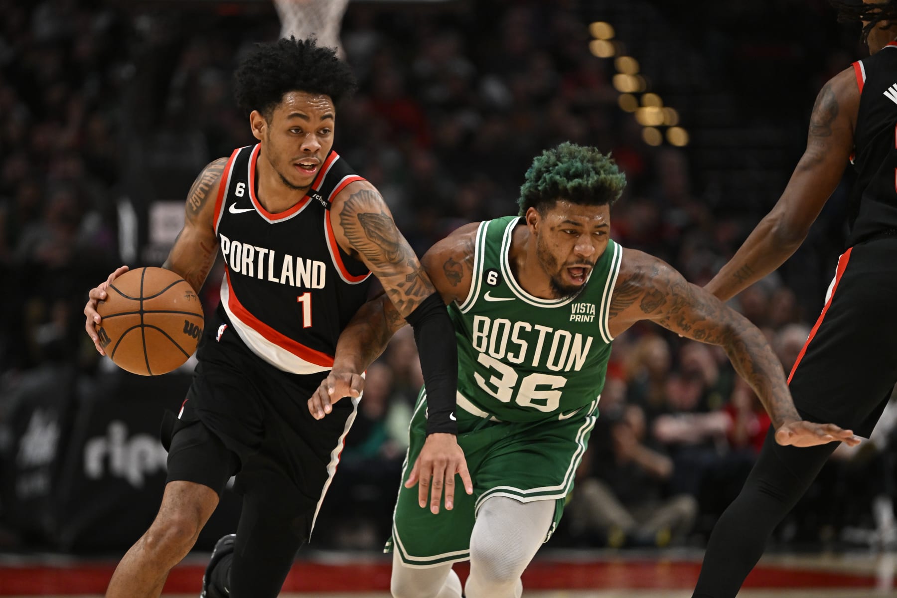 PORTLAND, OREGON - MARCH 17: Anfernee Simons #1 of the Portland Trail Blazers drives past Marcus Smart #36 of the Boston Celtics during the second quarter at the Moda Center on March 17, 2023 in Portland, Oregon. NOTE TO USER: User expressly acknowledges and agrees that, by downloading and or using this photograph, User is consenting to the terms and conditions of the Getty Images License Agreement. (Photo by Alika Jenner/Getty Images)