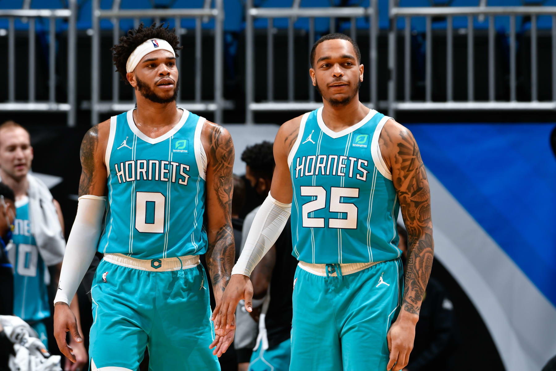 ORLANDO, FL - JANUARY 25: Miles Bridges #0 of the Charlotte Hornets and PJ Washington #25 of the Charlotte Hornets look on during the game against the Orlando Magic on January 25, 2021 at Amway Center in Orlando, Florida. NOTE TO USER: User expressly acknowledges and agrees that, by downloading and or using this photograph, User is consenting to the terms and conditions of the Getty Images License Agreement. Mandatory Copyright Notice: Copyright 2021 NBAE (Photo by Fernando Medina/NBAE via Getty Images)