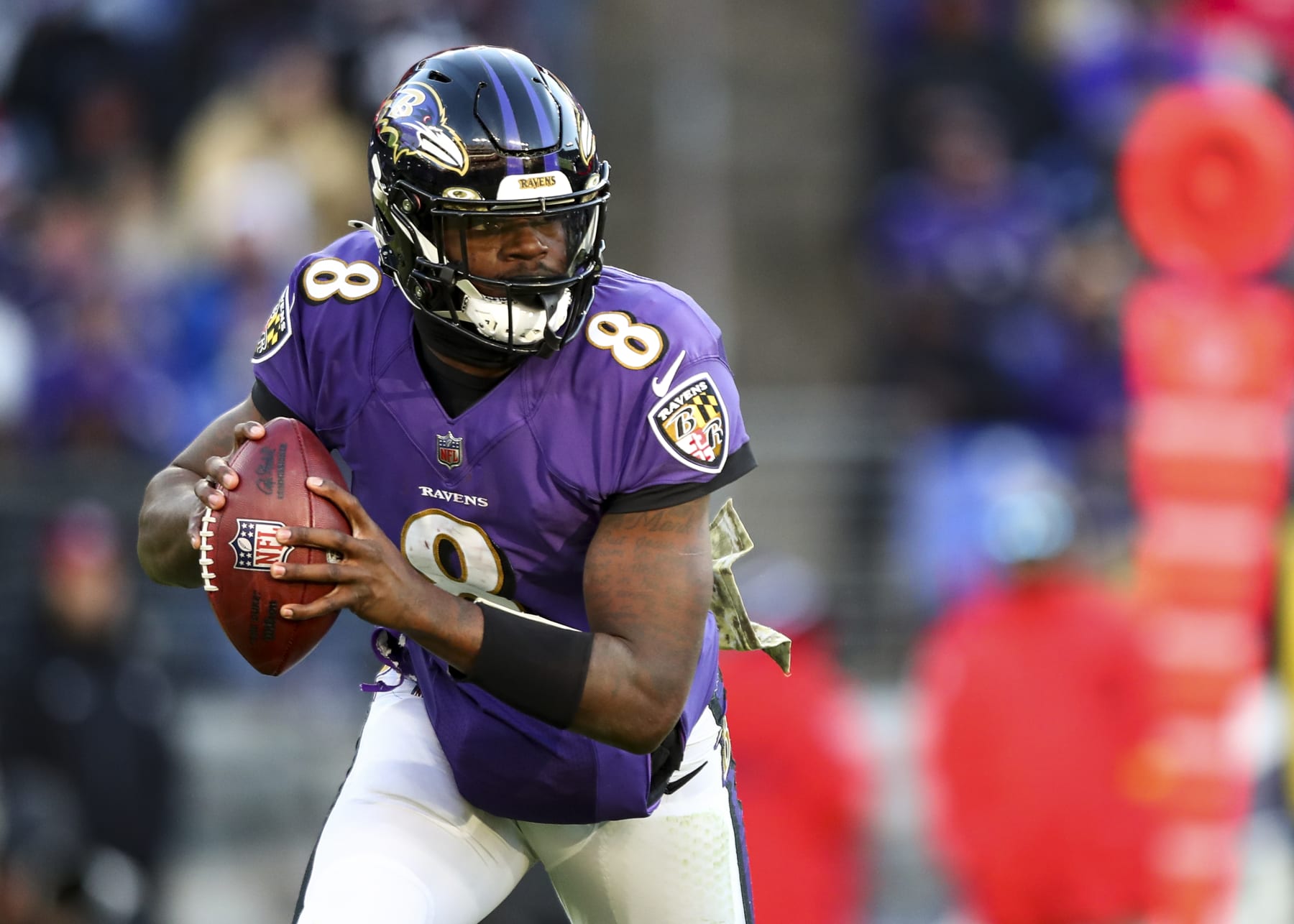 BALTIMORE, MD - NOVEMBER 20: Lamar Jackson #8 of the Baltimore Ravens drops back to pass during the fourth quarter of an NFL football game against the Carolina Panthers at M&T Bank Stadium on November 20, 2022 in Baltimore, Maryland. (Photo by Kevin Sabitus/Getty Images)
