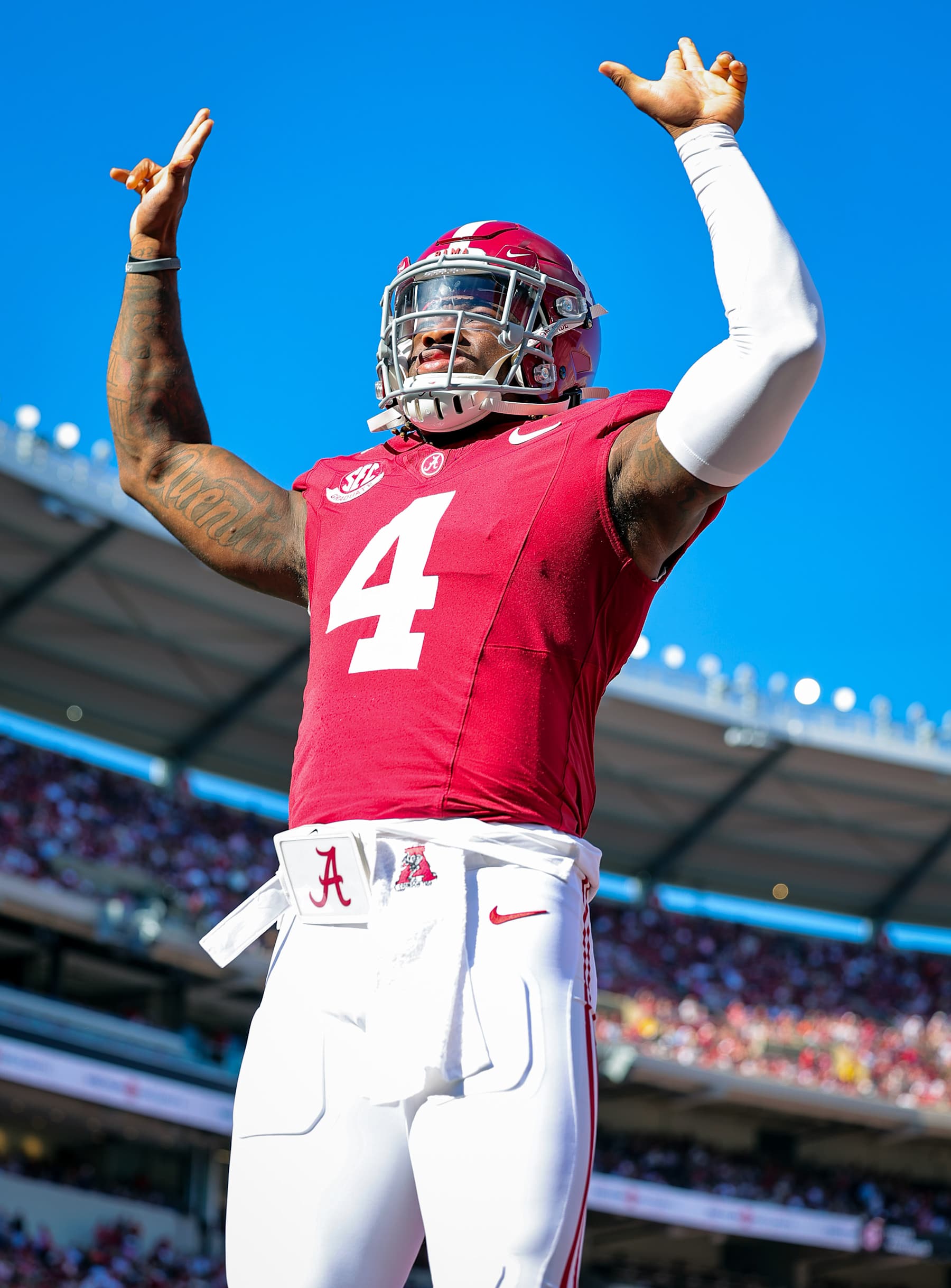 TUSCALOOSA, ALABAMA - NOVEMBER 16: Jalen Milroe #4 of the Alabama Crimson Tide puts up his guns prior to kickoff against the Mercer Bears at Bryant-Denny Stadium on November 16, 2024 in Tuscaloosa, Alabama. (Photo by Brandon Sumrall/Getty Images)