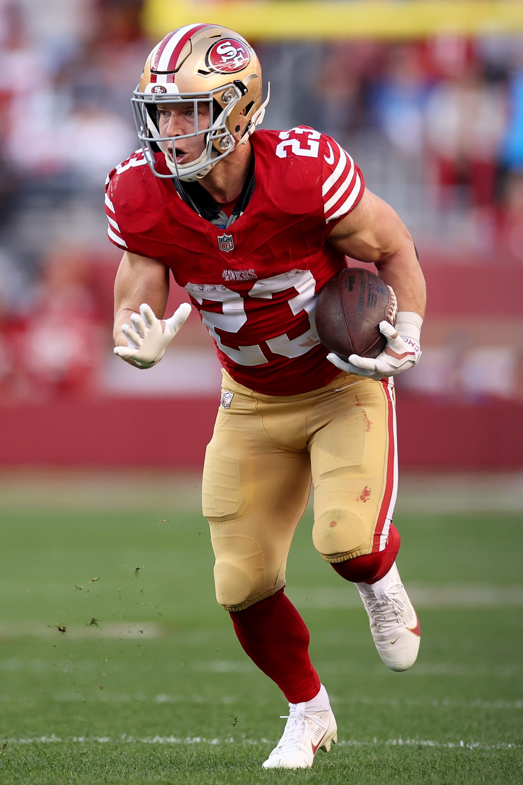 SANTA CLARA, CALIFORNIA - JANUARY 28: Christian McCaffrey #23 of the San Francisco 49ers runs the ball during the first quarter against the Detroit Lions in the NFC Championship Game at Levi's Stadium on January 28, 2024 in Santa Clara, California. (Photo by Ezra Shaw/Getty Images)