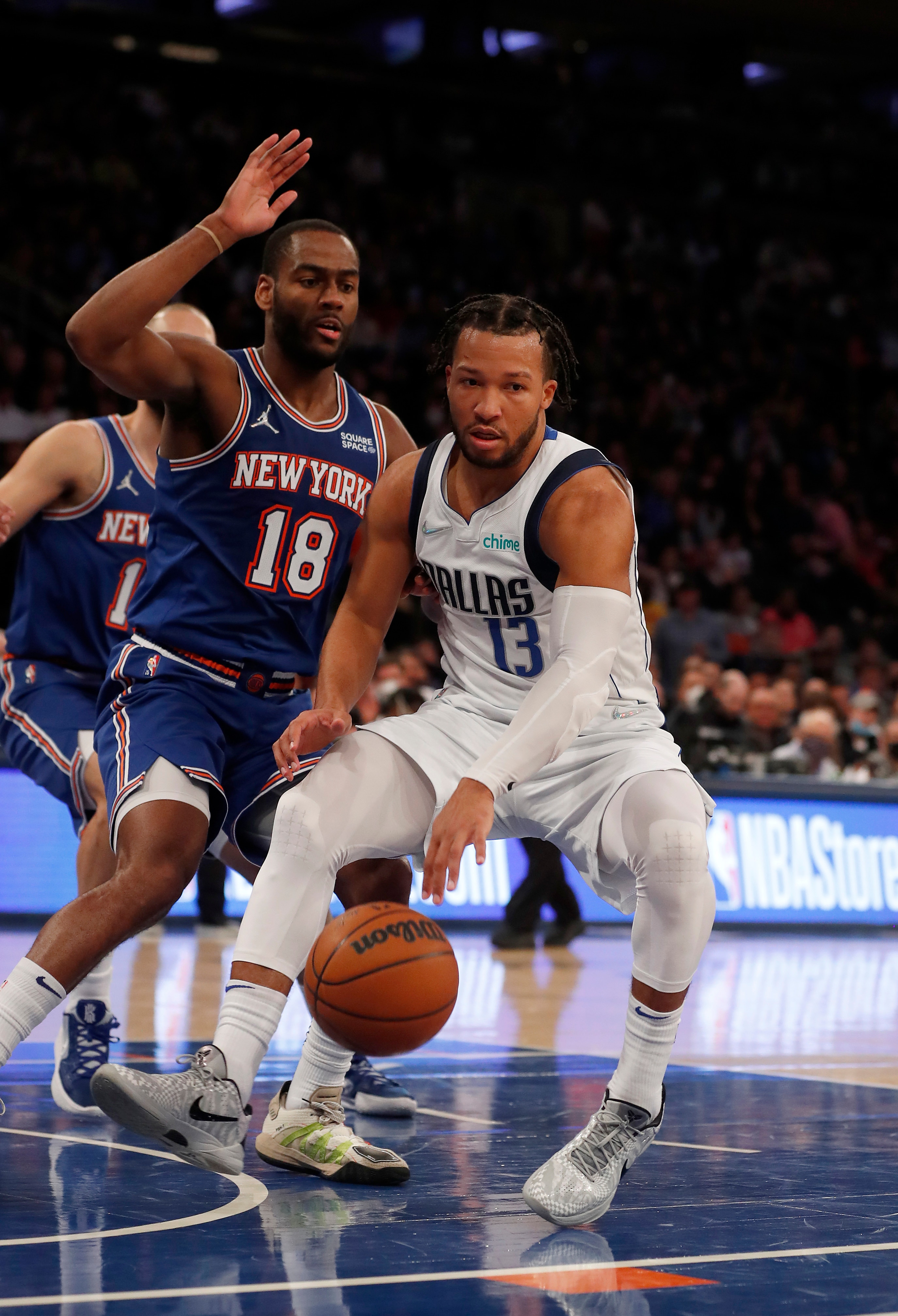 NEW YORK, NEW YORK - JANUARY 12: (NEW YORK DAILIES OUT)  Jalen Brunson #13 of the Dallas Mavericks in action against Alec Burks #18 of the New York Knicks at Madison Square Garden on January 12, 2022 in New York City. The Knicks defeated the Mavericks 108-85. NOTE TO USER: User expressly acknowledges and agrees that, by downloading and or using this photograph, user is consenting to the terms and conditions of the Getty Images License Agreement. (Photo by Jim McIsaac/Getty Images)