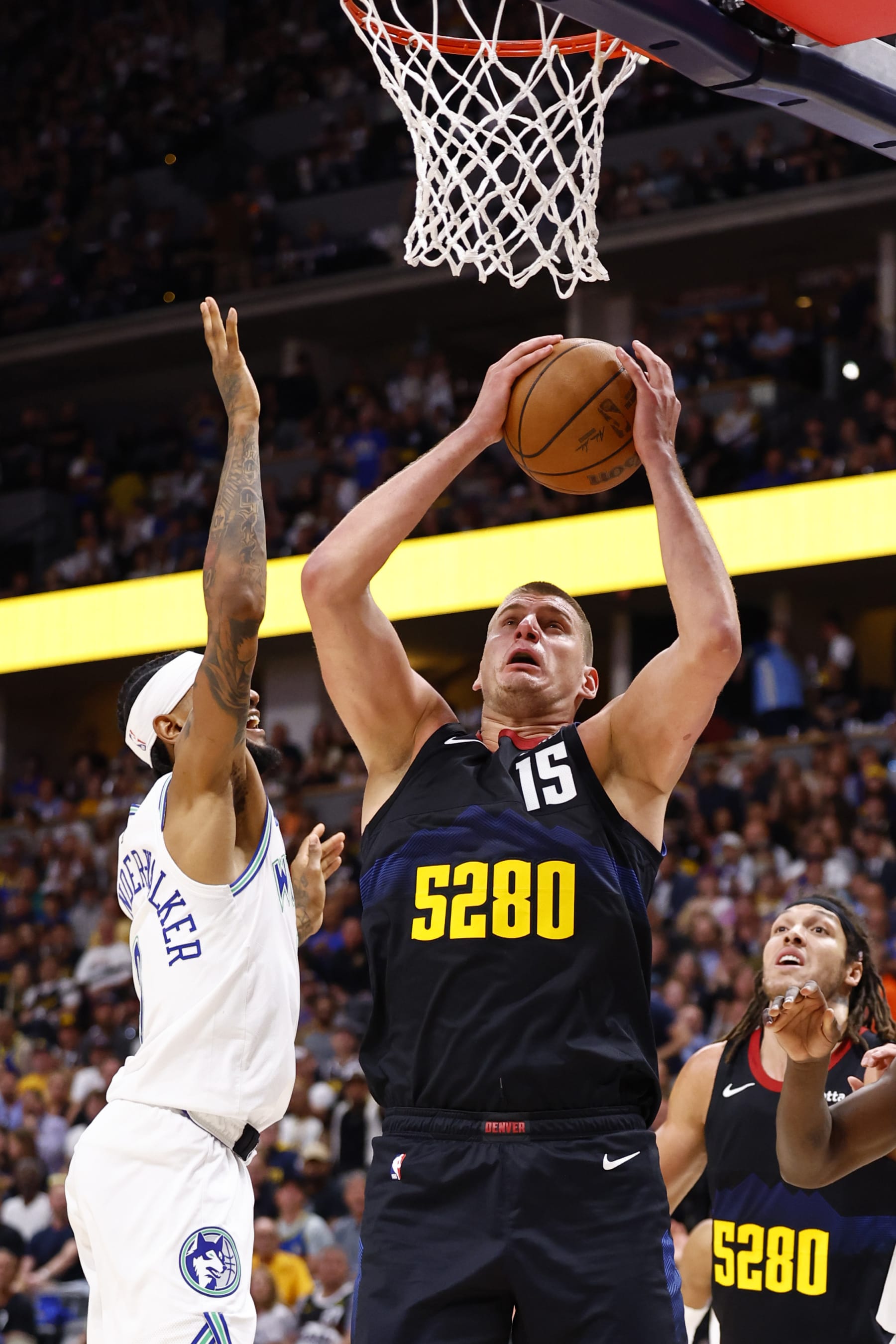 DENVER, COLORADO - MAY 19: Nikola Jokic #15 of the Denver Nuggets rebounds the ball against Nickeil Alexander-Walker #9 of the Minnesota Timberwolves during the second quarter in Game Seven of the Western Conference Second Round Playoffs at Ball Arena on May 19, 2024 in Denver, Colorado. NOTE TO USER: User expressly acknowledges and agrees that, by downloading and or using this photograph, User is consenting to the terms and conditions of the Getty Images License Agreement. (Photo by C. Morgan Engel/Getty Images)