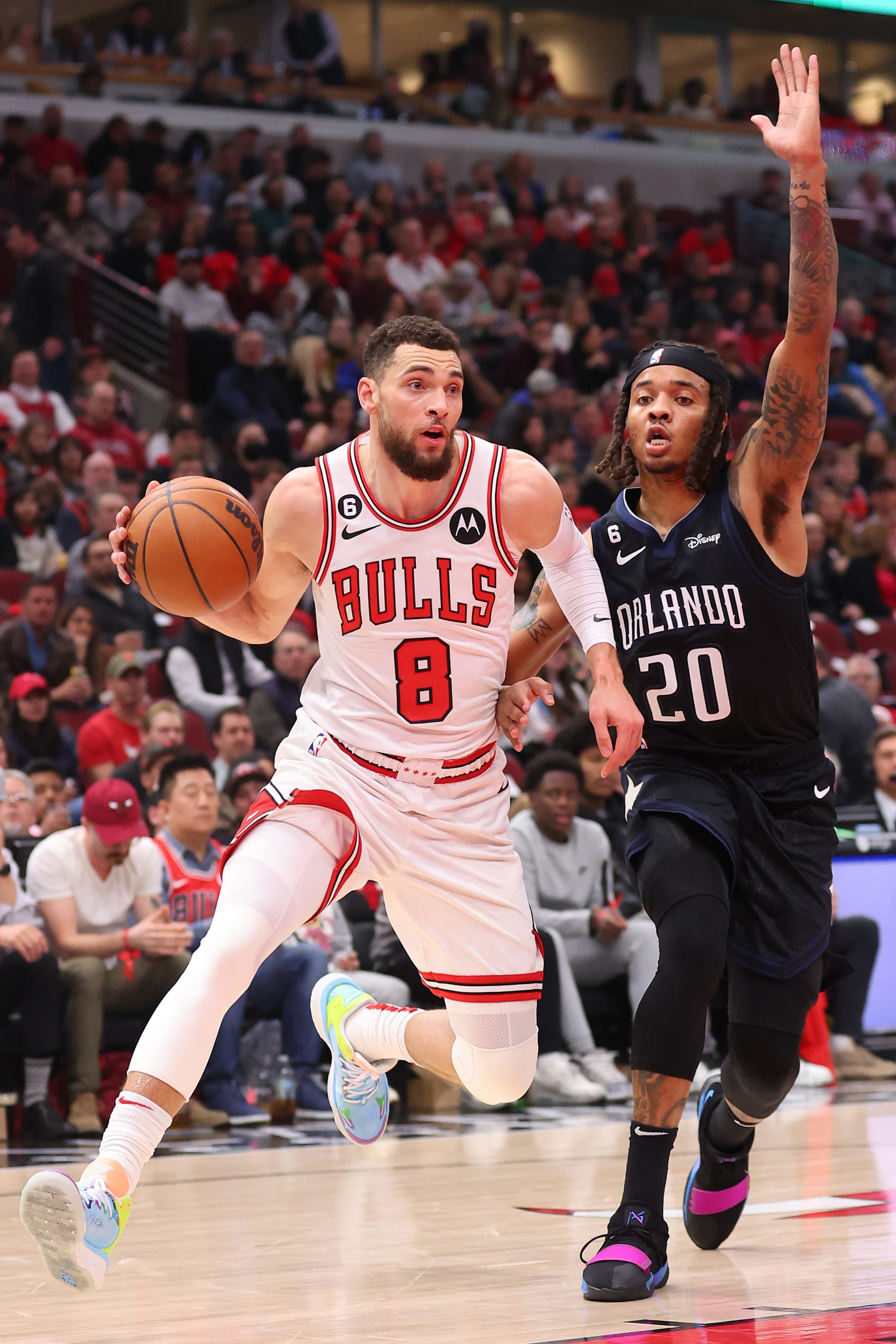 CHICAGO, ILLINOIS - FEBRUARY 13: Zach LaVine #8 of the Chicago Bulls drives to the basket against Markelle Fultz #20 of the Orlando Magic during the second half at United Center on February 13, 2023 in Chicago, Illinois. NOTE TO USER: User expressly acknowledges and agrees that, by downloading and or using this photograph, User is consenting to the terms and conditions of the Getty Images License Agreement.  (Photo by Michael Reaves/Getty Images)