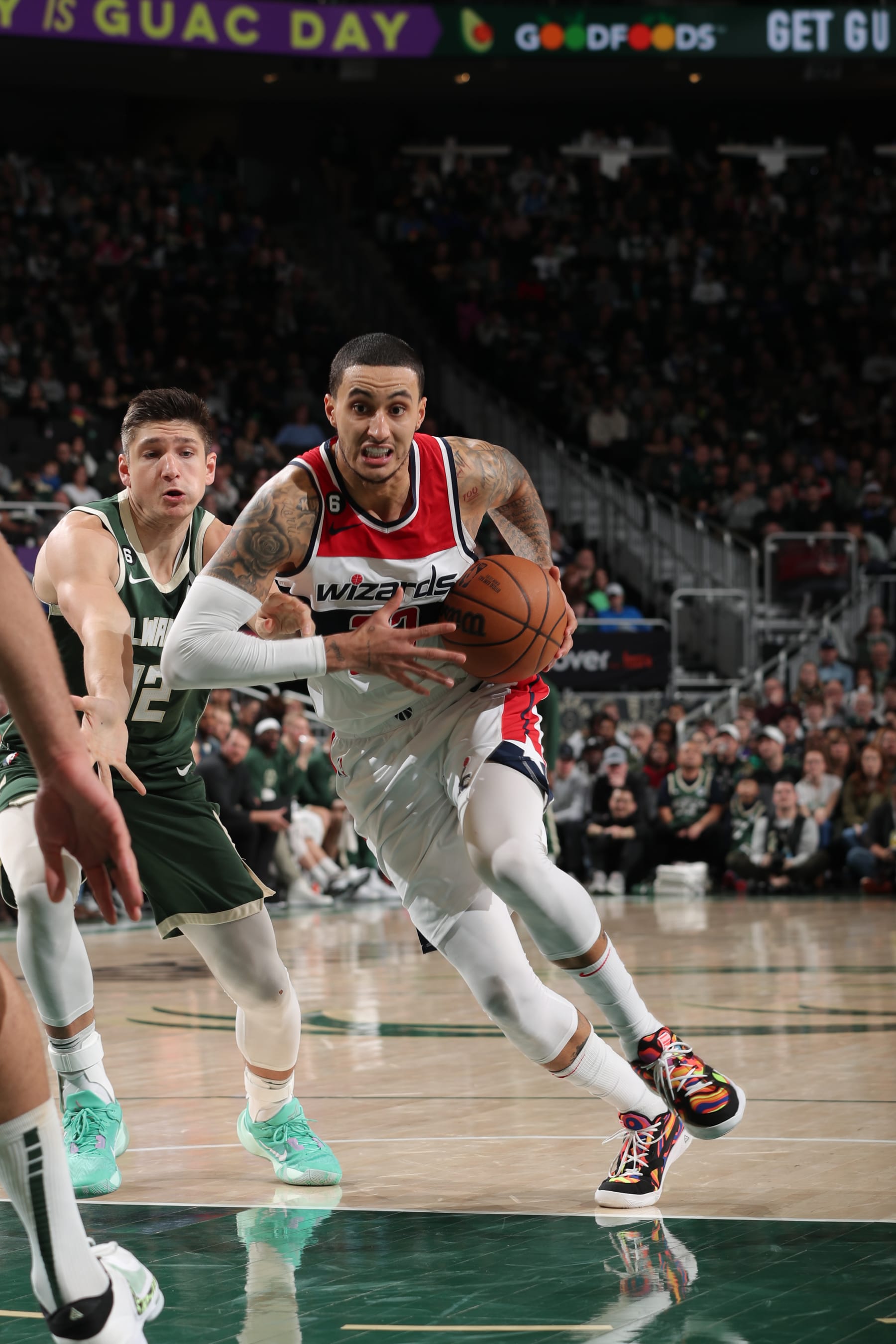 MILWAUKEE, WI - JANUARY 3: Kyle Kuzma #33 of the Washington Wizards drives to the basket during the game against the Milwaukee Bucks on January 3, 2023 at the Fiserv Forum Center in Milwaukee, Wisconsin. NOTE TO USER: User expressly acknowledges and agrees that, by downloading and or using this Photograph, user is consenting to the terms and conditions of the Getty Images License Agreement. Mandatory Copyright Notice: Copyright 2023 NBAE (Photo by Gary Dineen/NBAE via Getty Images).