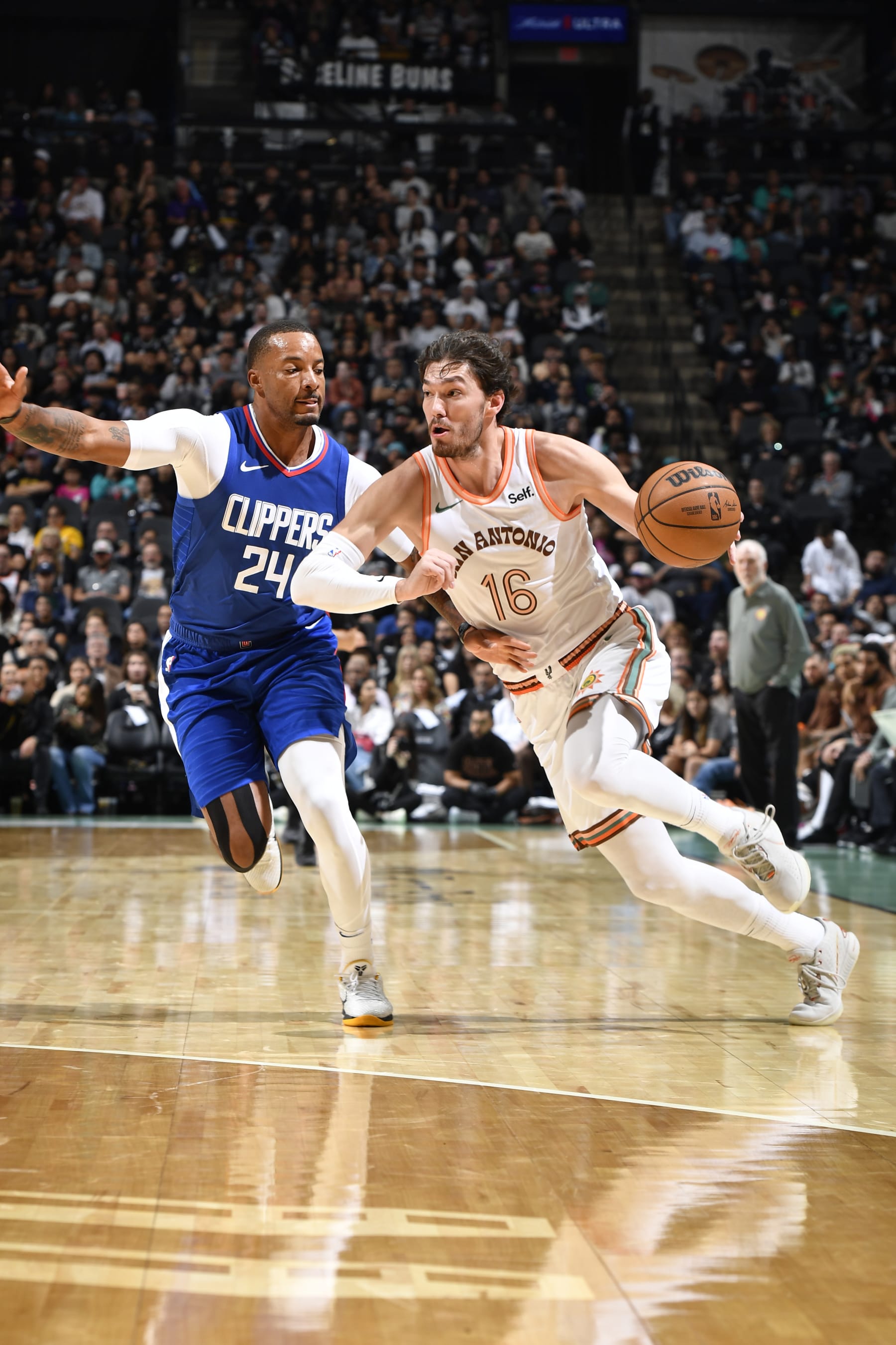 SAN ANTONIO, TX - NOVEMBER 20: Cedi Osman #16 of the San Antonio Spurs drives to the basket during the game against the LA Clippers on November 20, 2023 at the Frost Bank Center in San Antonio, Texas. NOTE TO USER: User expressly acknowledges and agrees that, by downloading and or using this photograph, user is consenting to the terms and conditions of the Getty Images License Agreement. Mandatory Copyright Notice: Copyright 2023 NBAE (Photos by Logan Riely/NBAE via Getty Images)