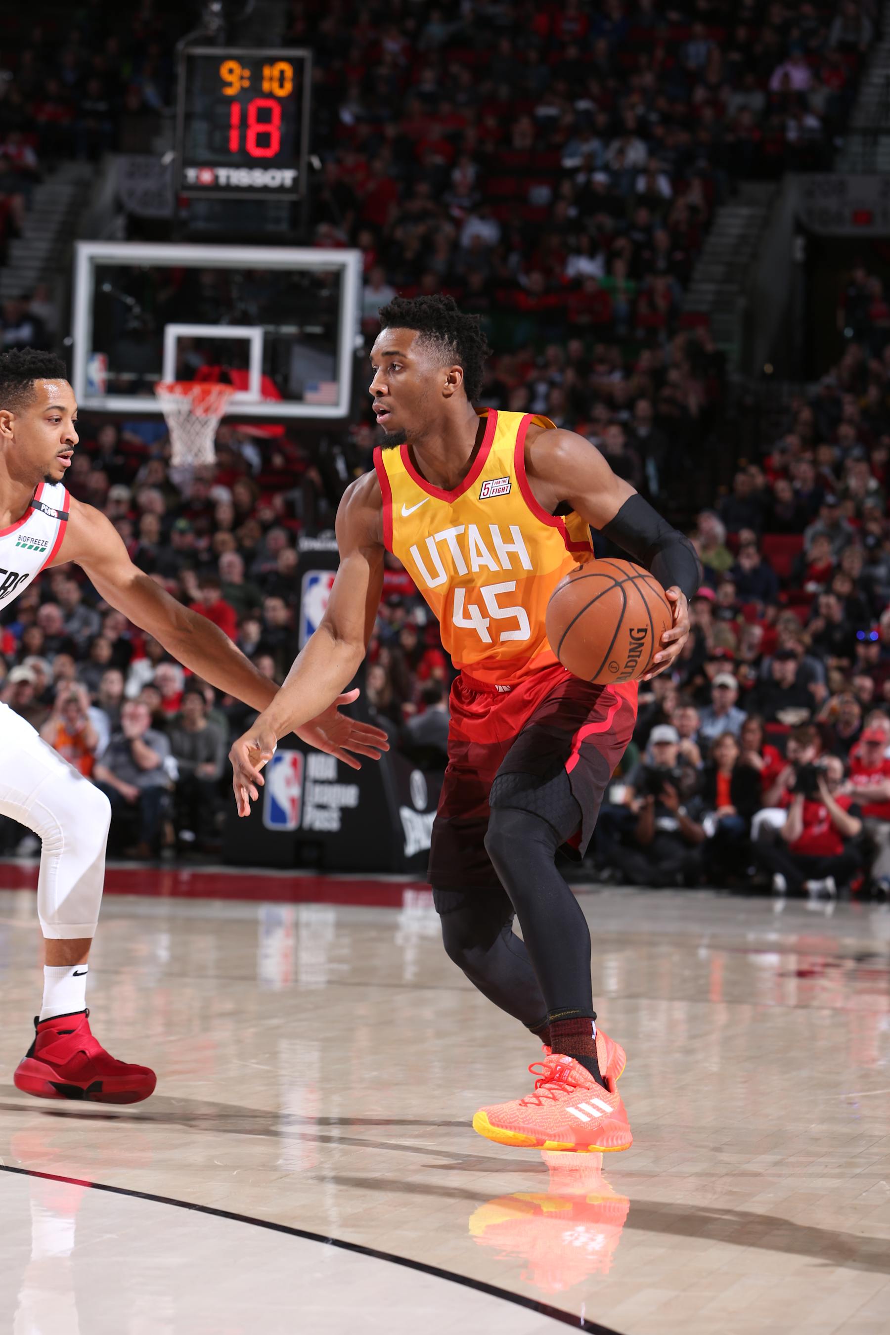 PORTLAND, OR - JANUARY 30: Donovan Mitchell #45 of the Utah Jazz handles the ball against the Portland Trail Blazers on January 30, 2018 at the Moda Center in Portland, Oregon. NOTE TO USER: User expressly acknowledges and agrees that, by downloading and or using this Photograph, user is consenting to the terms and conditions of the Getty Images License Agreement. Mandatory Copyright Notice: Copyright 2019 NBAE (Photo by Sam Forencich/NBAE via Getty Images)