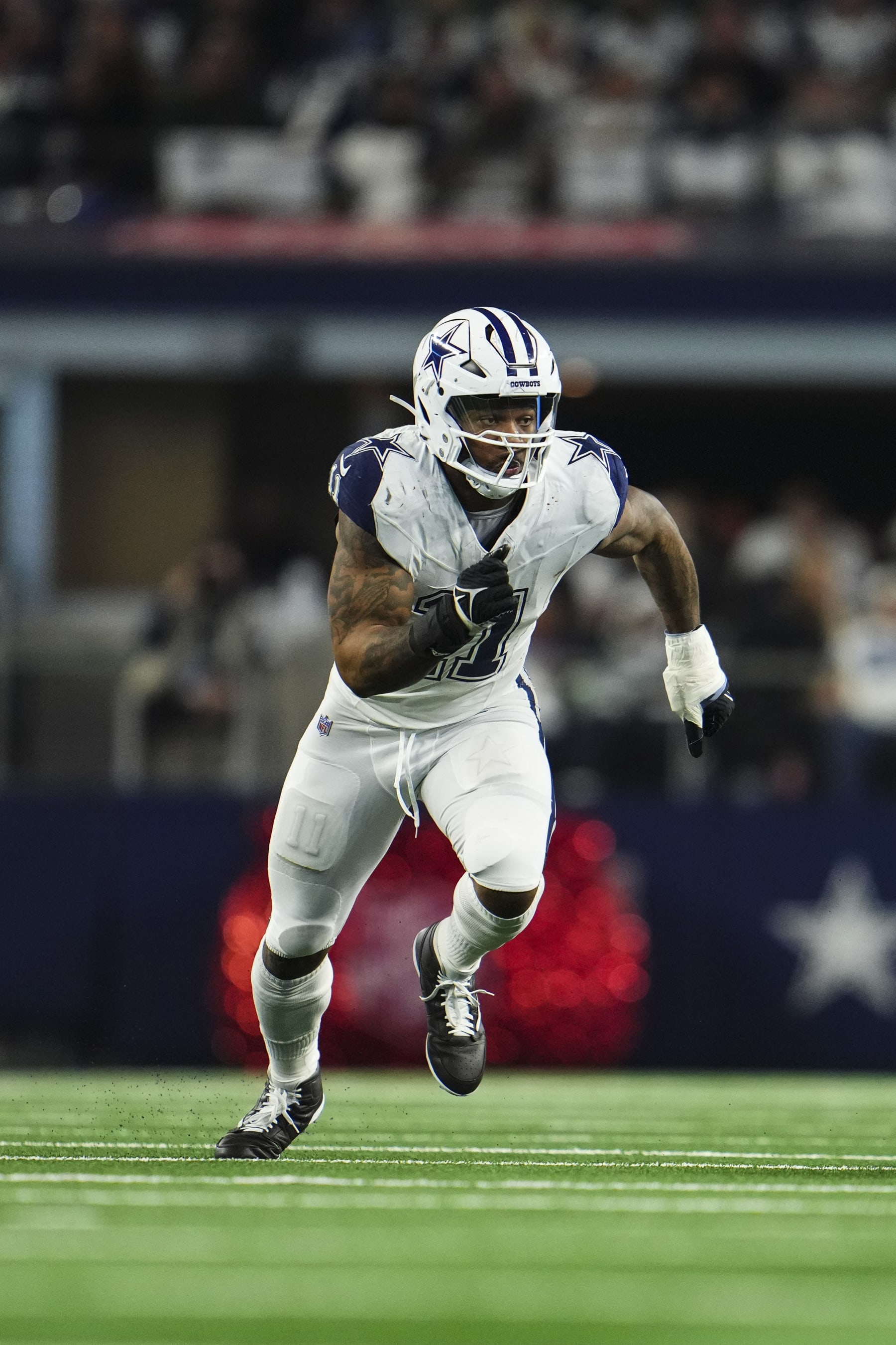 ARLINGTON, TX - DECEMBER 10: Micah Parsons #11 of the Dallas Cowboys rushes the passer during an NFL football game against the Philadelphia Eagles at AT&T Stadium on December 10, 2023 in Arlington, Texas. (Photo by Cooper Neill/Getty Images)