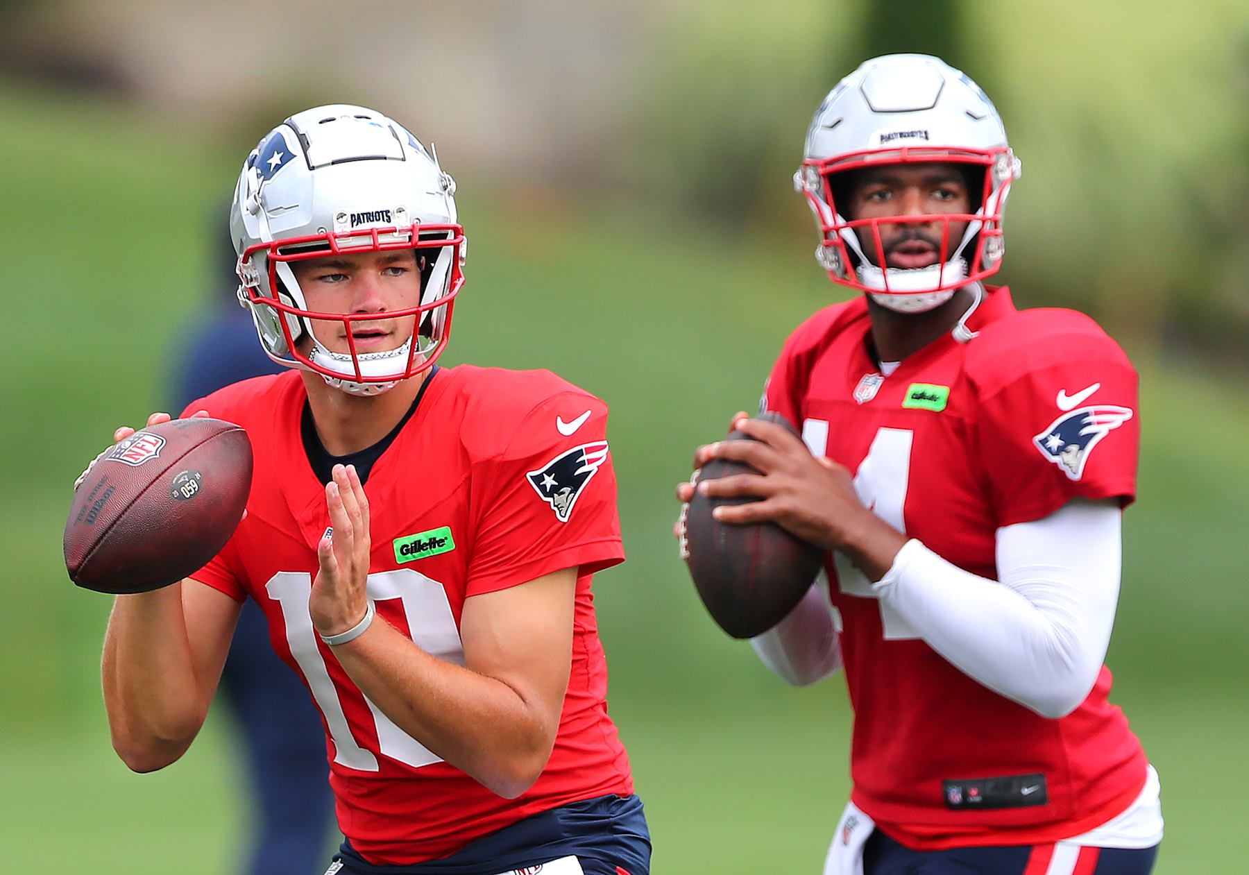New England Patriots quarterbacks Drake Maye (left) and Jacoby Brissett (right)