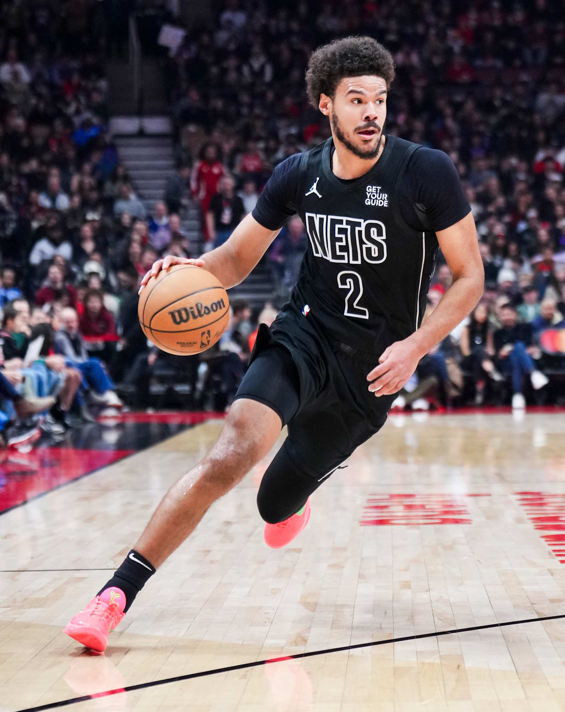 TORONTO, ON - JANUARY 1: Cameron Johnson #2 of the Brooklyn Nets dribbles against the Toronto Raptors during the first half of their basketball game at the Scotiabank Arena on January 1, 2025 in Toronto, Ontario, Canada. NOTE TO USER: User expressly acknowledges and agrees that, by downloading and/or using this Photograph, user is consenting to the terms and conditions of the Getty Images License Agreement. (Photo by Mark Blinch/Getty Images)