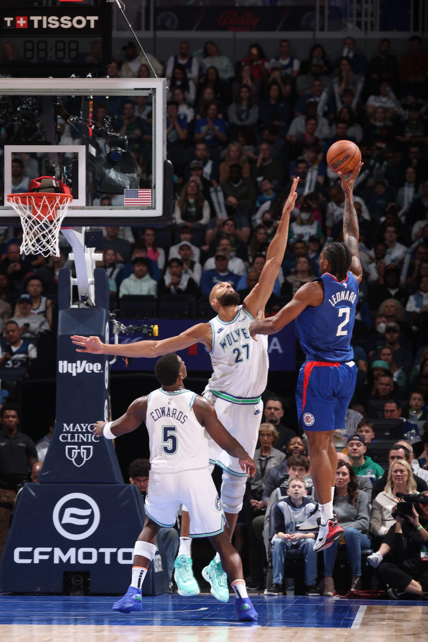 MINNEAPOLIS, MN -  MARCH 3: Kawhi Leonard #2 of the LA Clippers shoots the ball over Rudy Gobert #27 and Anthony Edwards #5 of the Minnesota Timberwolves during the game on March 3, 2024 at Target Center in Minneapolis, Minnesota. NOTE TO USER: User expressly acknowledges and agrees that, by downloading and or using this Photograph, user is consenting to the terms and conditions of the Getty Images License Agreement. Mandatory Copyright Notice: Copyright 2024 NBAE (Photo by David Sherman/NBAE via Getty Images)