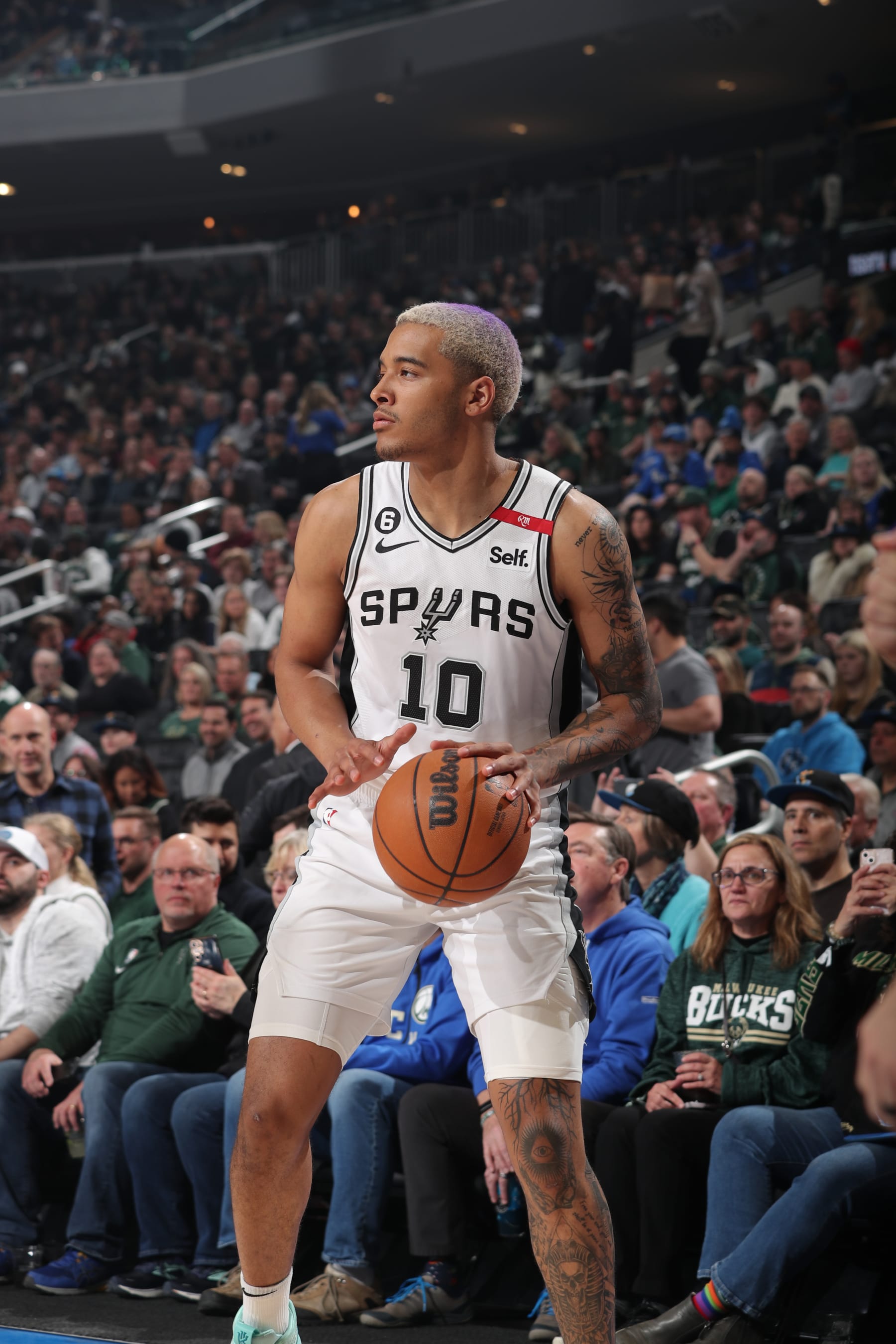 MILWAUKEE, WI - MARCH 22: Jeremy Sochan #10 of the San Antonio Spurs handles the ball during the game against the Milwaukee Bucks on March 22, 2023 at the Fiserv Forum Center in Milwaukee, Wisconsin. NOTE TO USER: User expressly acknowledges and agrees that, by downloading and or using this Photograph, user is consenting to the terms and conditions of the Getty Images License Agreement. Mandatory Copyright Notice: Copyright 2023 NBAE (Photo by Gary Dineen/NBAE via Getty Images).