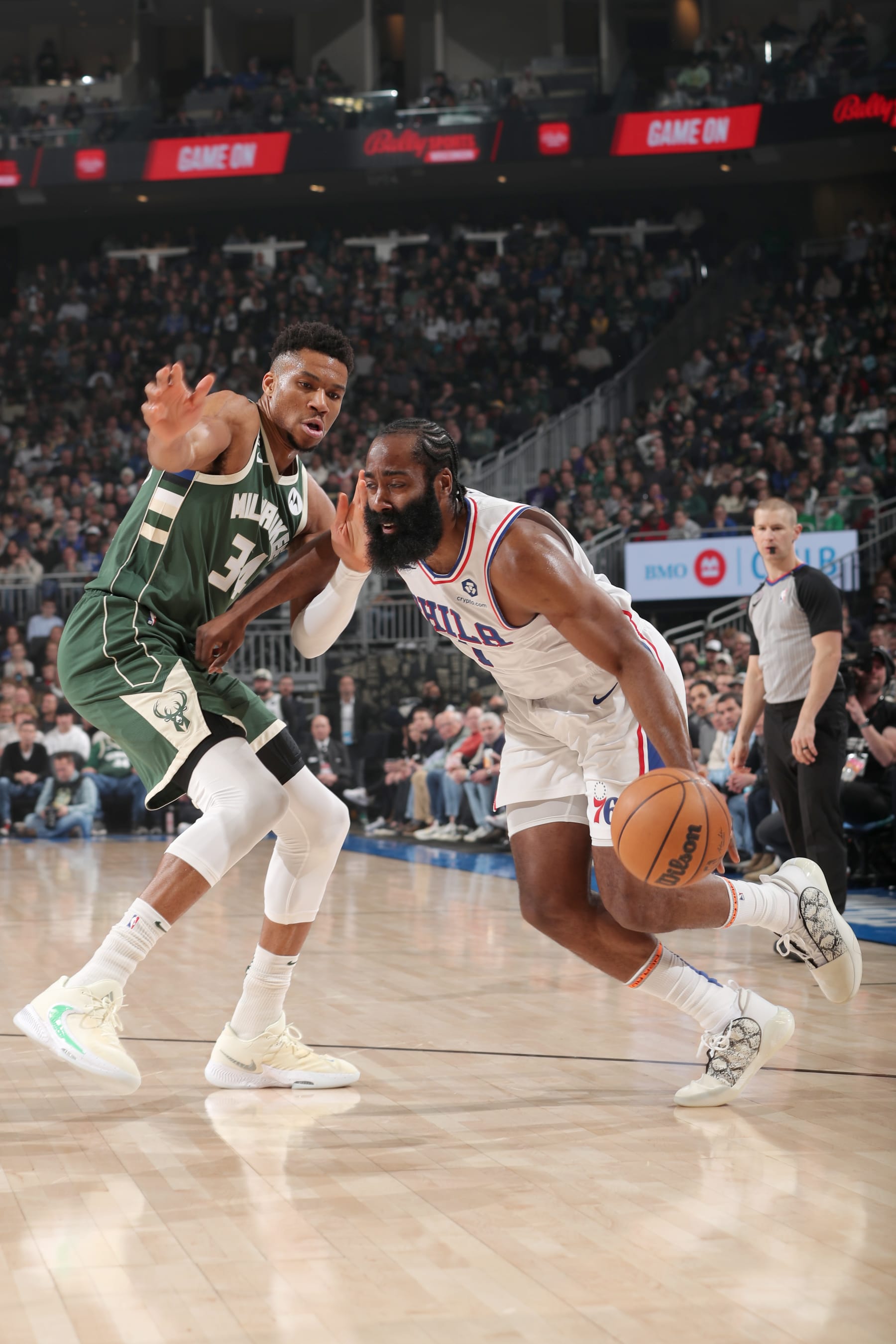 MILWAUKEE, WI - MARCH 4: James Harden #1 of the Philadelphia 76ers drives against Giannis Antetokounmpo #34 of the Milwaukee Bucks during the game on March 4, 2023 at the Fiserv Forum Center in Milwaukee, Wisconsin. NOTE TO USER: User expressly acknowledges and agrees that, by downloading and or using this Photograph, user is consenting to the terms and conditions of the Getty Images License Agreement. Mandatory Copyright Notice: Copyright 2023 NBAE (Photo by Gary Dineen/NBAE via Getty Images).