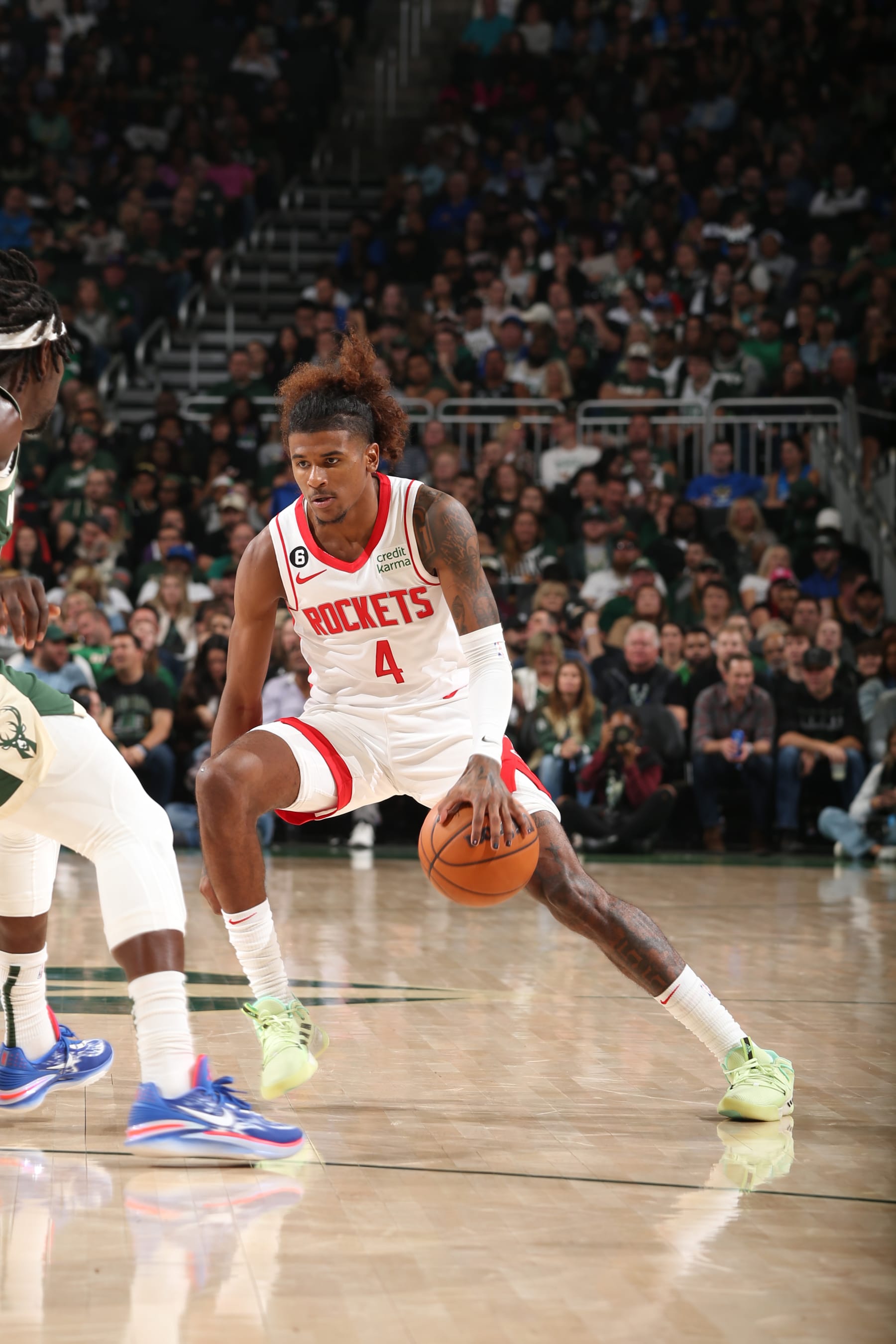 MILWAUKEE, WI - OCTOBER 22: Jalen Green #4 of the Houston Rockets dribbles the ball during the game against the Milwaukee Bucks on October 22, 2022 at the Fiserv Forum Center in Milwaukee, Wisconsin. NOTE TO USER: User expressly acknowledges and agrees that, by downloading and or using this Photograph, user is consenting to the terms and conditions of the Getty Images License Agreement. Mandatory Copyright Notice: Copyright 2022 NBAE (Photo by Gary Dineen/NBAE via Getty Images).