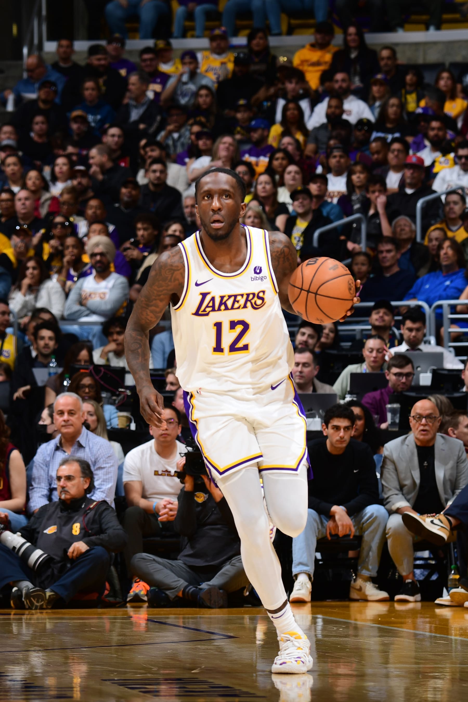LOS ANGELES, CA - APRIL 6: Taurean Prince #12 of the Los Angeles Lakers dribbles the ball during the game against the Cleveland Cavaliers on April 6, 2024 at Crypto.Com Arena in Los Angeles, California. NOTE TO USER: User expressly acknowledges and agrees that, by downloading and/or using this Photograph, user is consenting to the terms and conditions of the Getty Images License Agreement. Mandatory Copyright Notice: Copyright 2024 NBAE (Photo by Adam Pantozzi/NBAE via Getty Images)