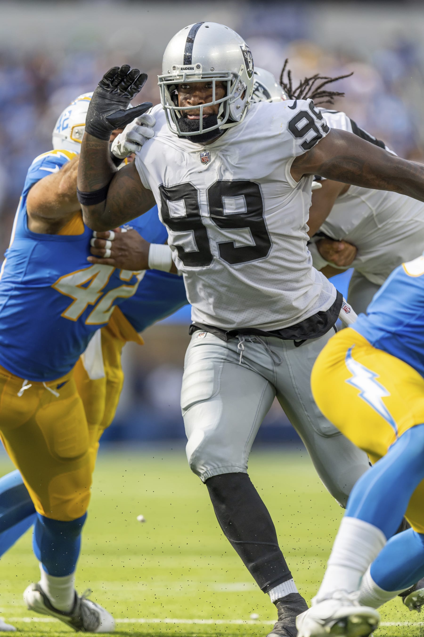 Defensive end (99) Clelin Ferrell of the Las Vegas Raiders against the Los Angeles Chargers in an NFL football game, Sunday, Sept. 11, 2022, in Inglewood, Calif. Chargers won 24-19. (AP Photo/Jeff Lewis)