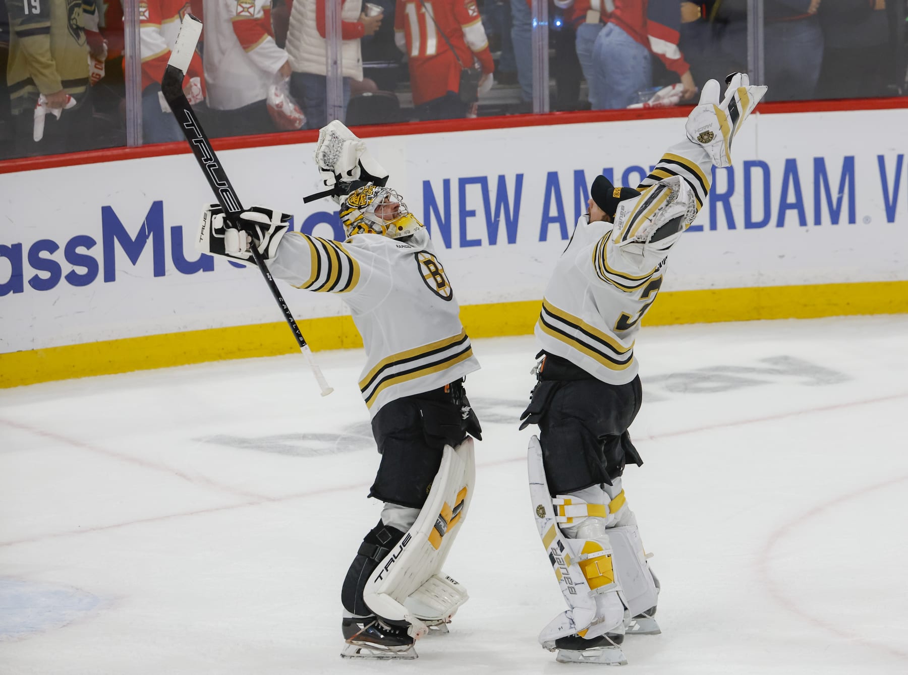 Sunrise, FL - May 14: Boston Bruins goalie Jeremy Swayman celebrates the 2-1 victory with teammate Linus Ullmark. (Photo by Matthew J. Lee/The Boston Globe via Getty Images)