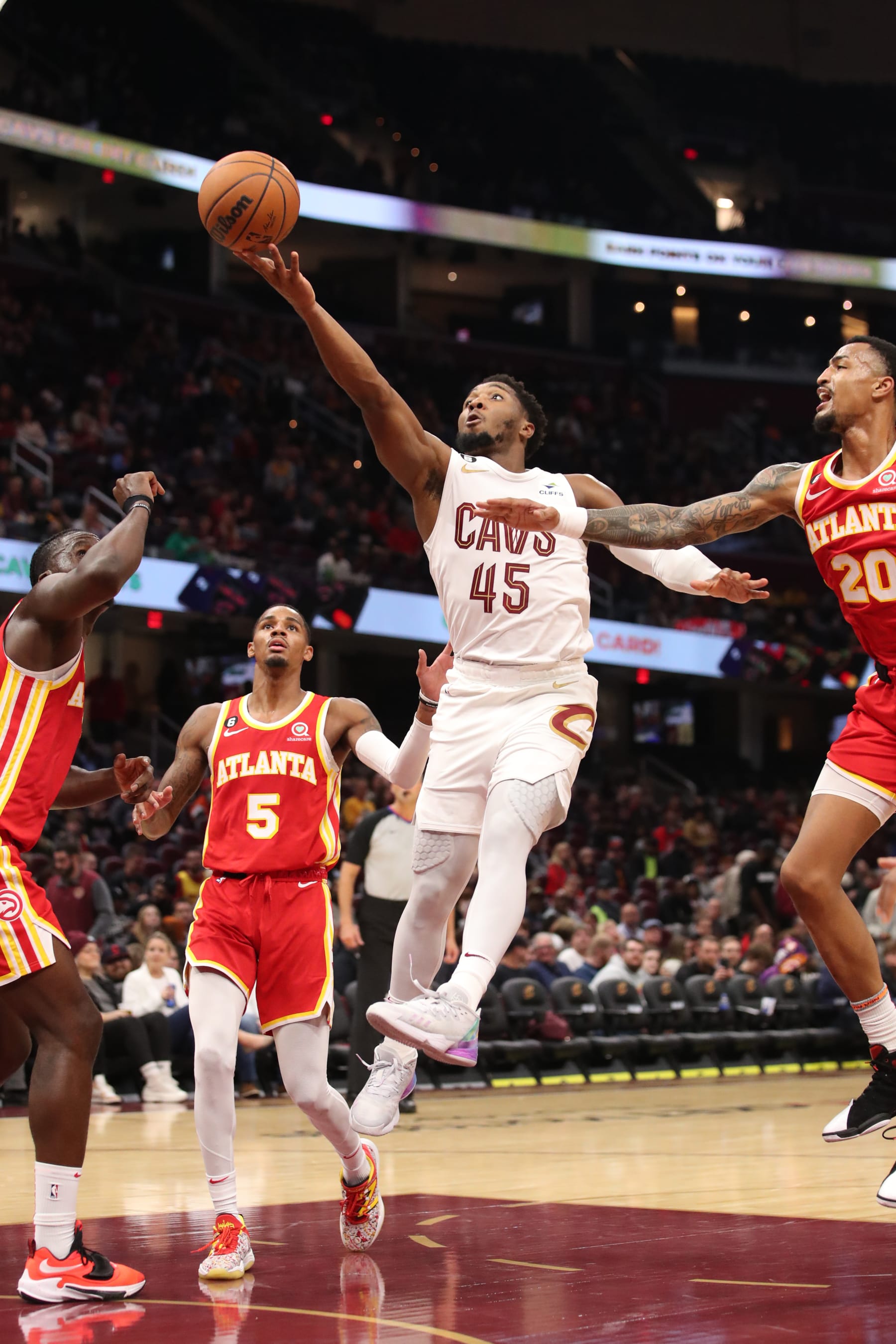 CLEVELAND, OH - OCTOBER 12: Donovan Mitchell #45 of the Cleveland Cavaliers drives to the basket during the game against the Atlanta Hawks on October 12, 2022 at Rocket Mortgage FieldHouse in Cleveland, Ohio. NOTE TO USER: User expressly acknowledges and agrees that, by downloading and/or using this Photograph, user is consenting to the terms and conditions of the Getty Images License Agreement. Mandatory Copyright Notice: Copyright 2022 NBAE (Photo by  Lauren Bacho/NBAE via Getty Images)