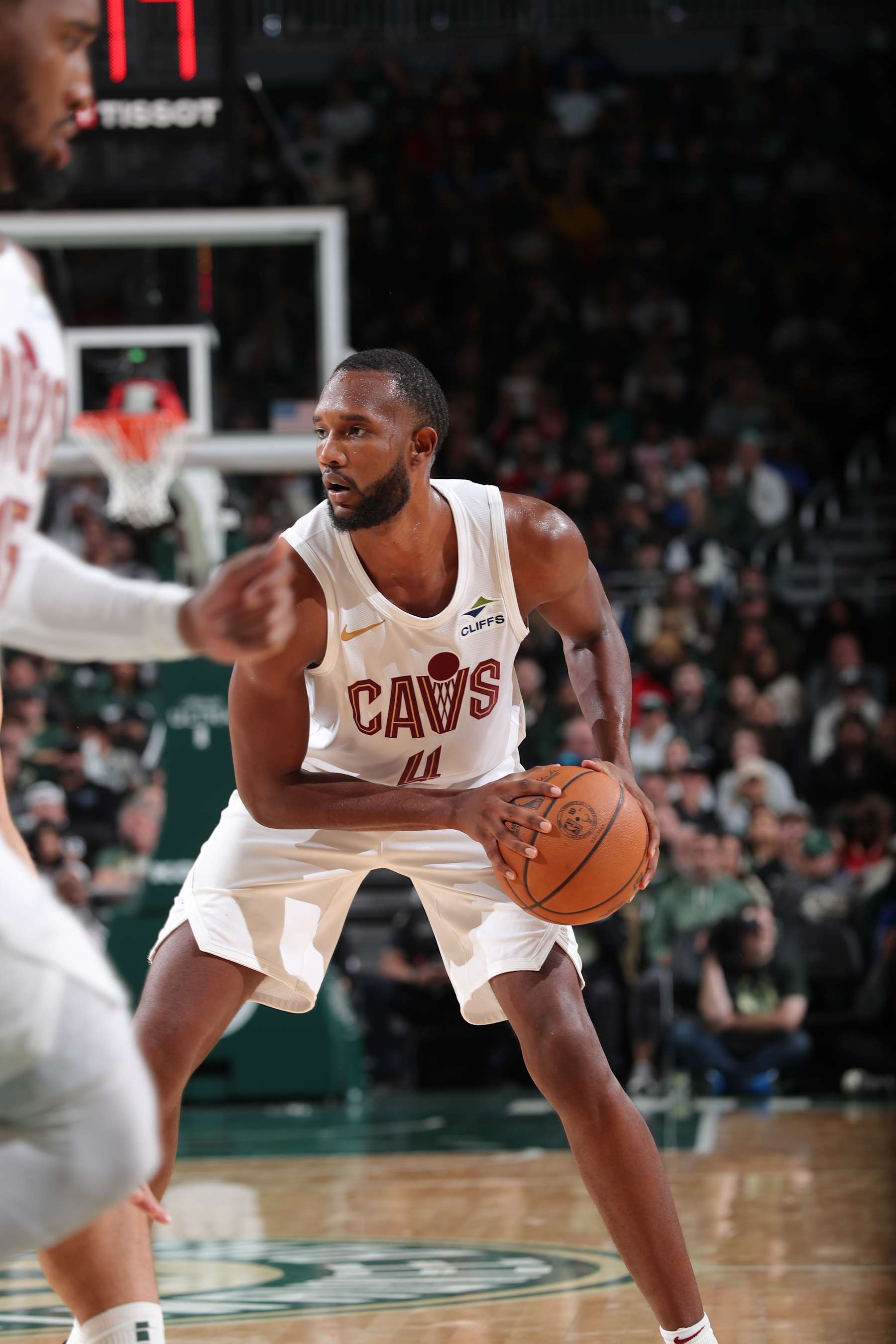 MILWAUKEE, WI - NOVEMBER 2: Evan Mobley #4 of the Cleveland Cavaliers handles the ball during the game against the Milwaukee Bucks  during a regular season game on November  2, 2024 at Fiserv Forum Center in Milwaukee, Wisconsin. NOTE TO USER: User expressly acknowledges and agrees that, by downloading and or using this Photograph, user is consenting to the terms and conditions of the Getty Images License Agreement. Mandatory Copyright Notice: Copyright 2024 NBAE (Photo by Gary Dineen/NBAE via Getty Images).