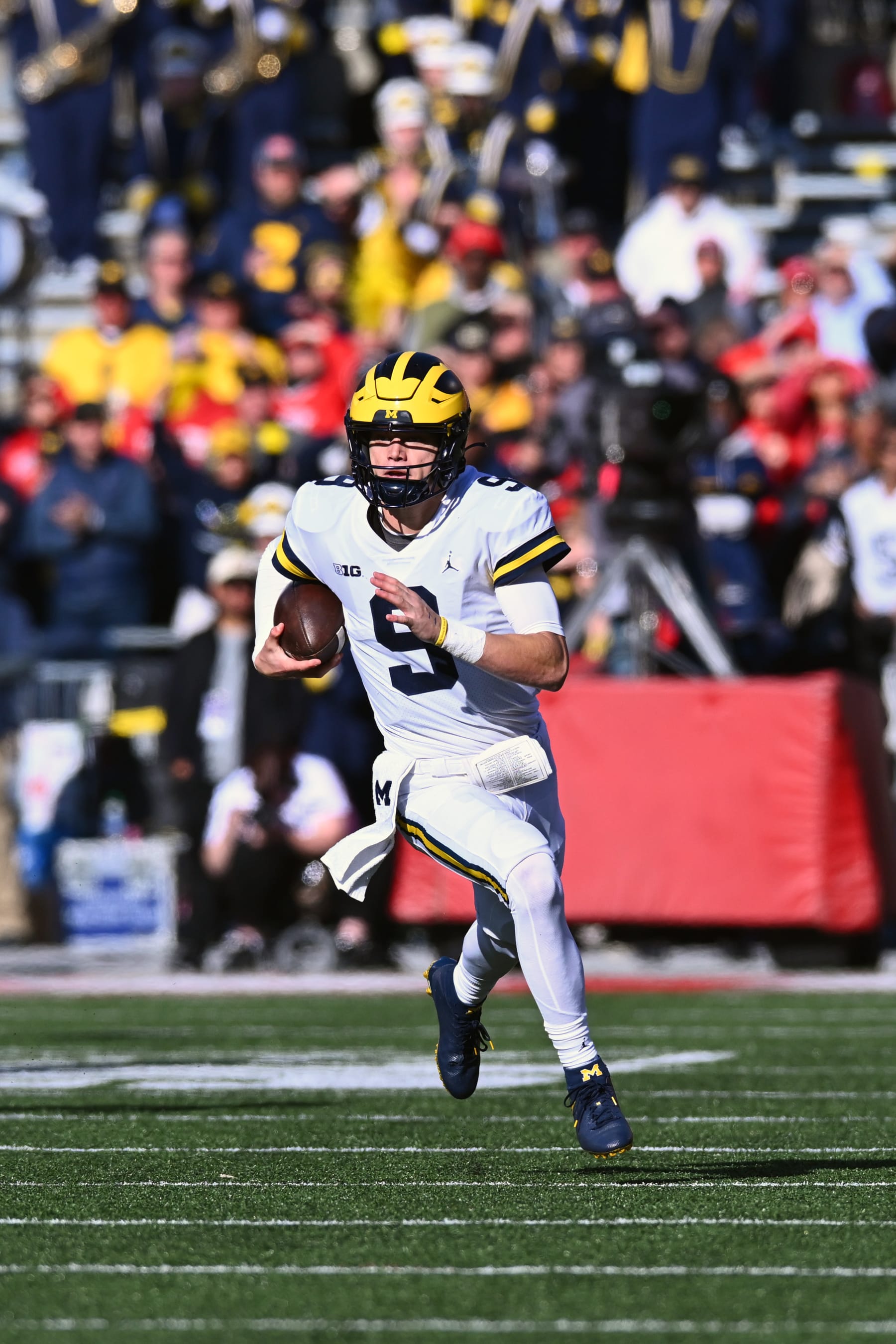 COLUMBUS, OHIO - NOVEMBER 26: J.J. McCarthy #9 of the Michigan Wolverines runs with the ball during the second quarter of a game against the Ohio State Buckeyes at Ohio Stadium on November 26, 2022 in Columbus, Ohio. (Photo by Ben Jackson/Getty Images)