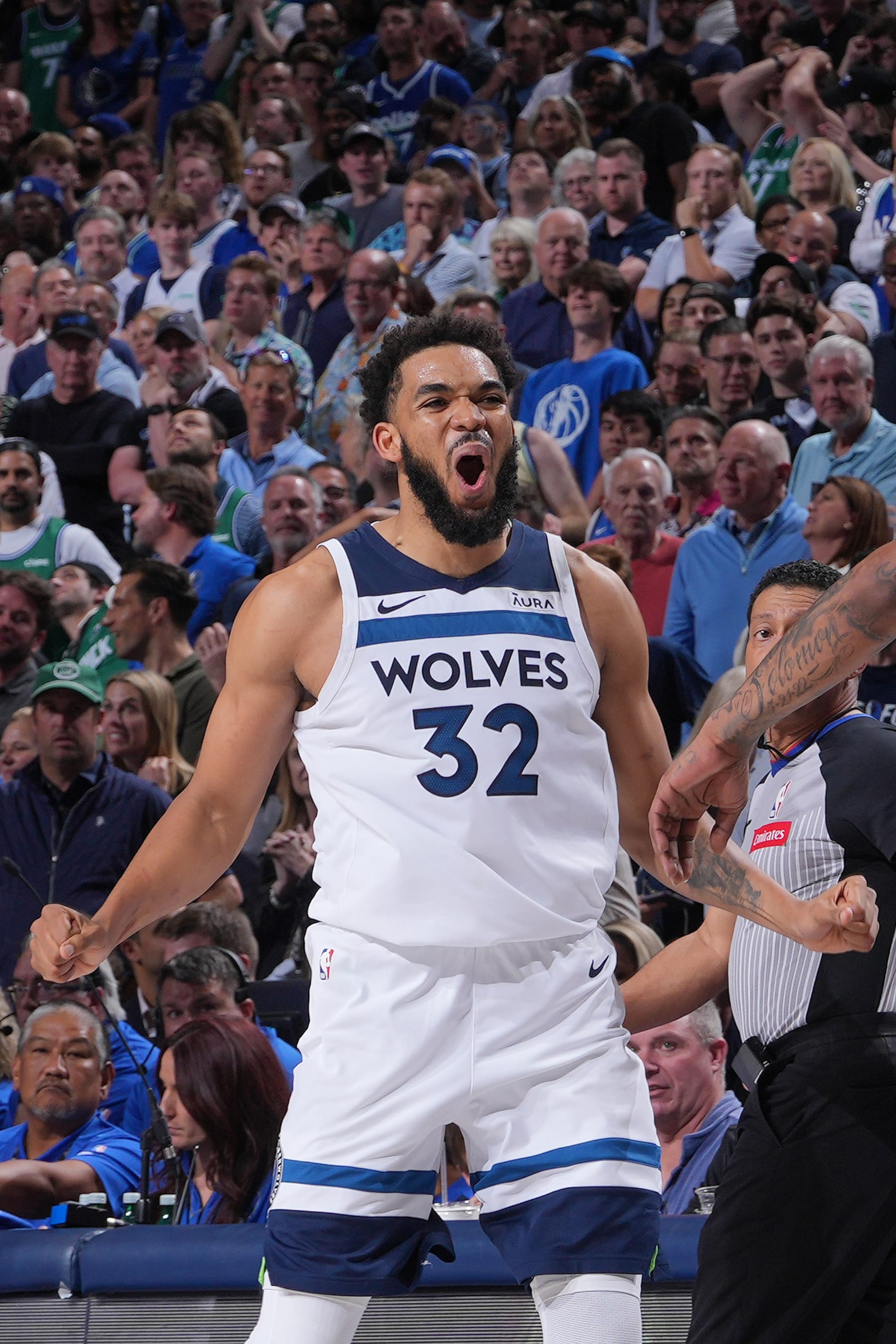 DALLAS, TX - MAY 28: Karl-Anthony Towns #32 of the Minnesota Timberwolves celebrates during the game against the Dallas Mavericks during Game 3 of the Western Conference Finals of the 2024 NBA Playoffs on May 28, 2024 at the American Airlines Center in Dallas, Texas. NOTE TO USER: User expressly acknowledges and agrees that, by downloading and or using this photograph, User is consenting to the terms and conditions of the Getty Images License Agreement. Mandatory Copyright Notice: Copyright 2024 NBAE (Photo by Jesse D. Garrabrant/NBAE via Getty Images)