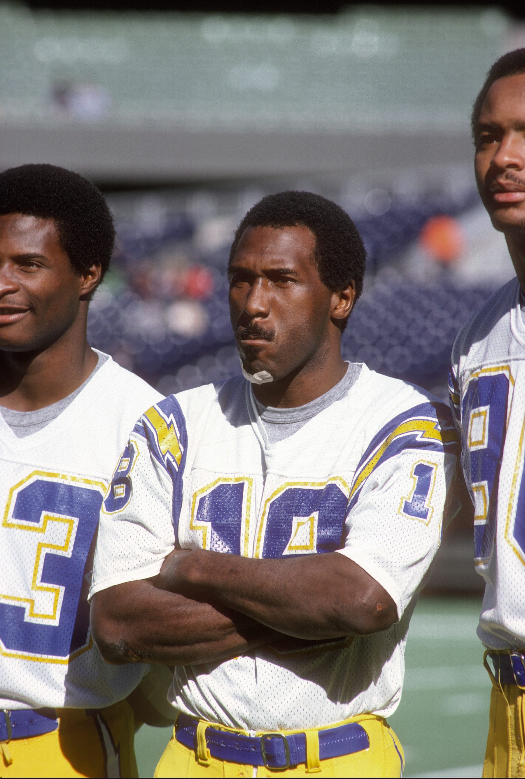SAN DIEGO, CA - CIRCA 1980:  Charlie Joiner #18, John Jefferson #83 and Kellen Winslow #80 of the San Diego Chargers looks on prior to the start of an NFL football game circa 1980 at Jack Murphy Stadium in San Diego, California. Joiner played for the Chargers from 1976-86. (Photo by Focus on Sport/Getty Images)